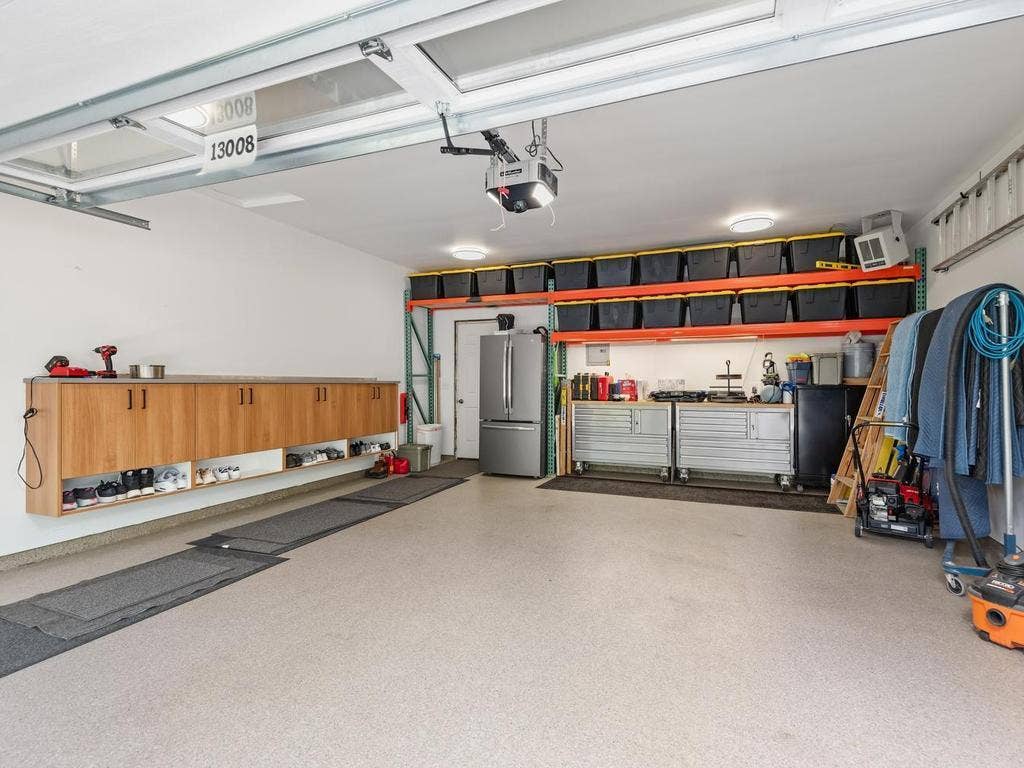 13008 Lakeview Drive Drive, Burnsville, MN 55337 The heated two-car garage offers built-in storage and room for a work area.