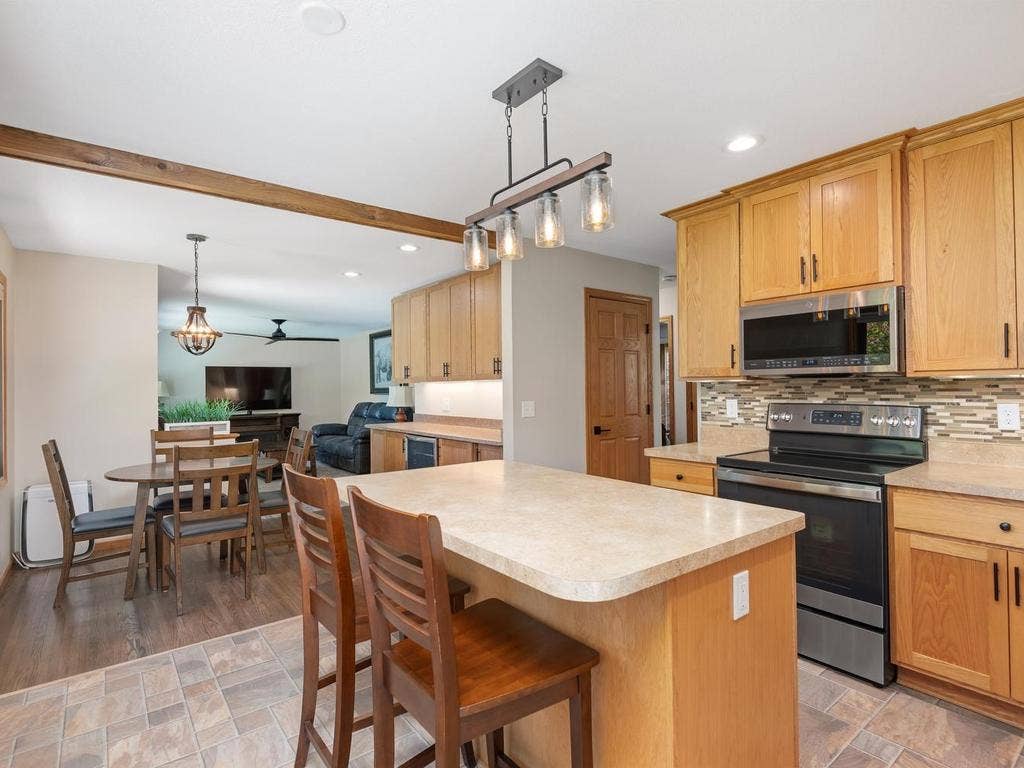 13008 Lakeview Drive Drive, Burnsville, MN 55337 The kitchen opens to the dining and living areas, keeping the main level connected.