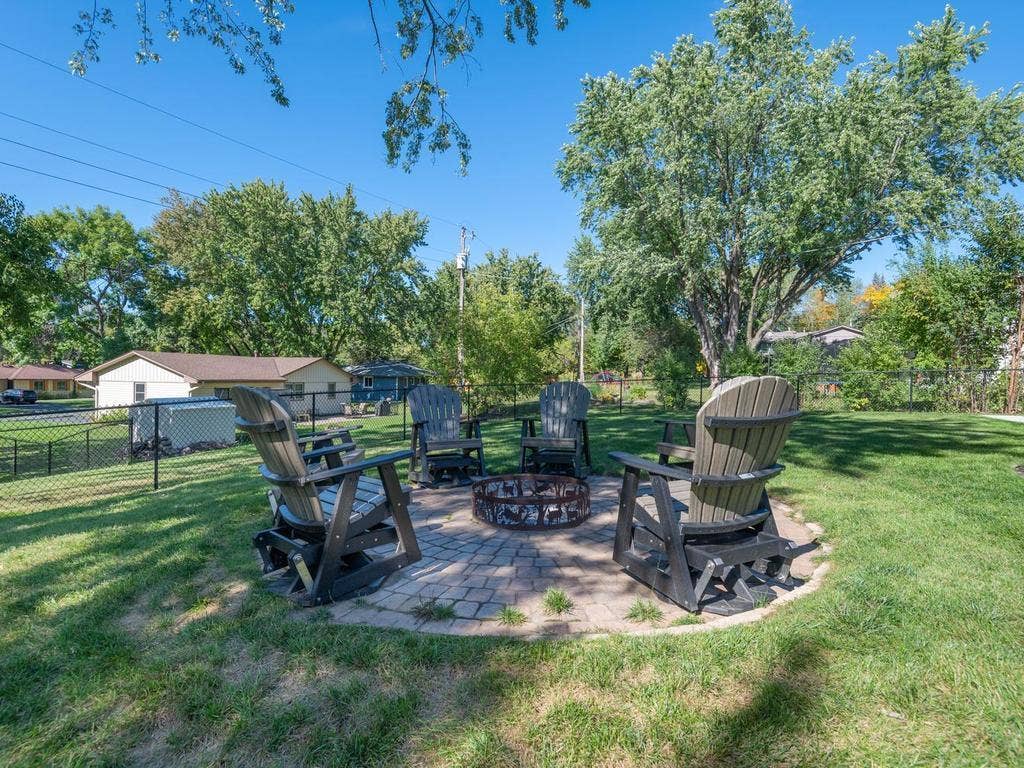 13008 Lakeview Drive Drive, Burnsville, MN 55337 Gather around the fire pit in the fenced backyard.