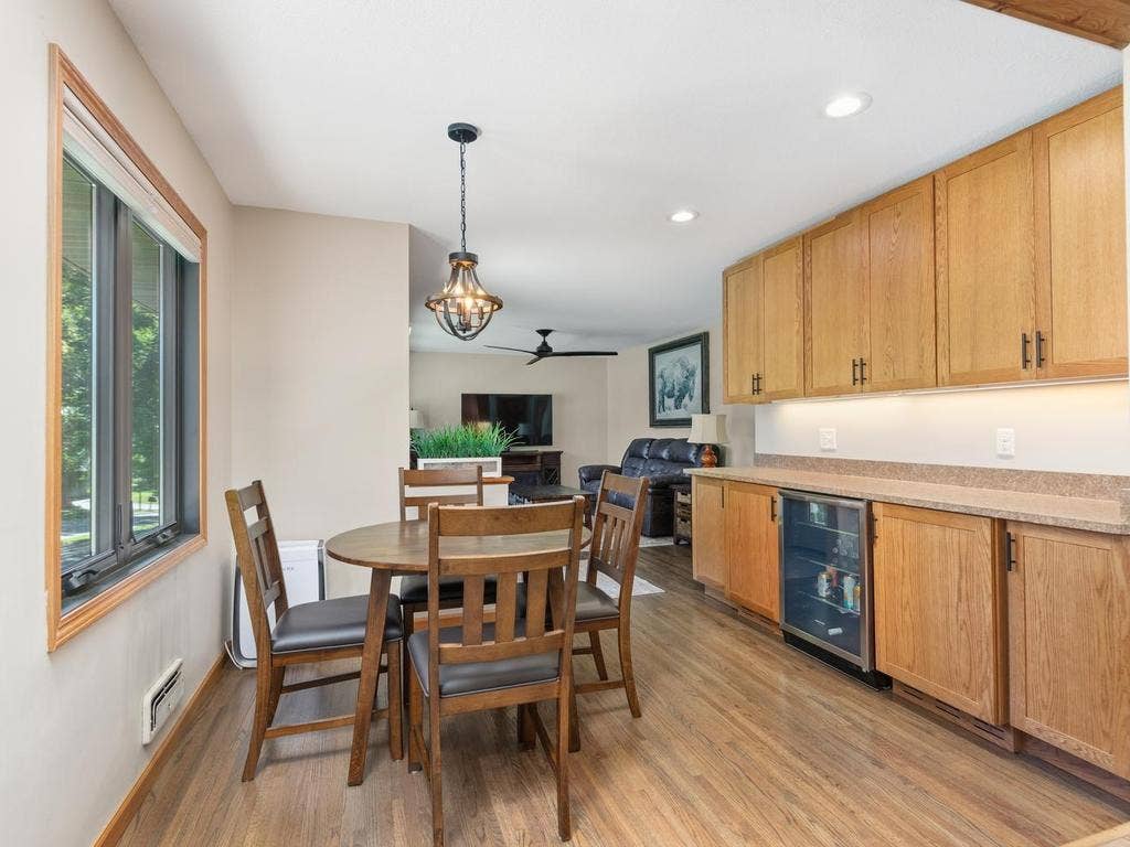 13008 Lakeview Drive Drive, Burnsville, MN 55337 The dining area features a large window and additional storage cabinetry.