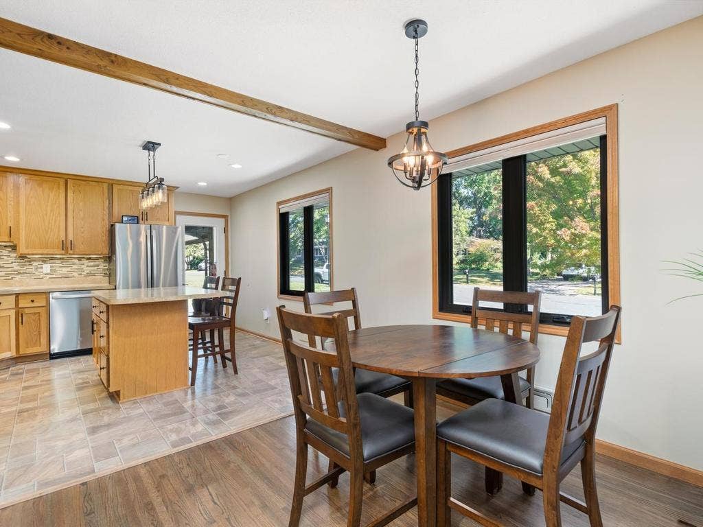 13008 Lakeview Drive Drive, Burnsville, MN 55337 The dining area sits just off the kitchen, with a large window overlooking the yard.