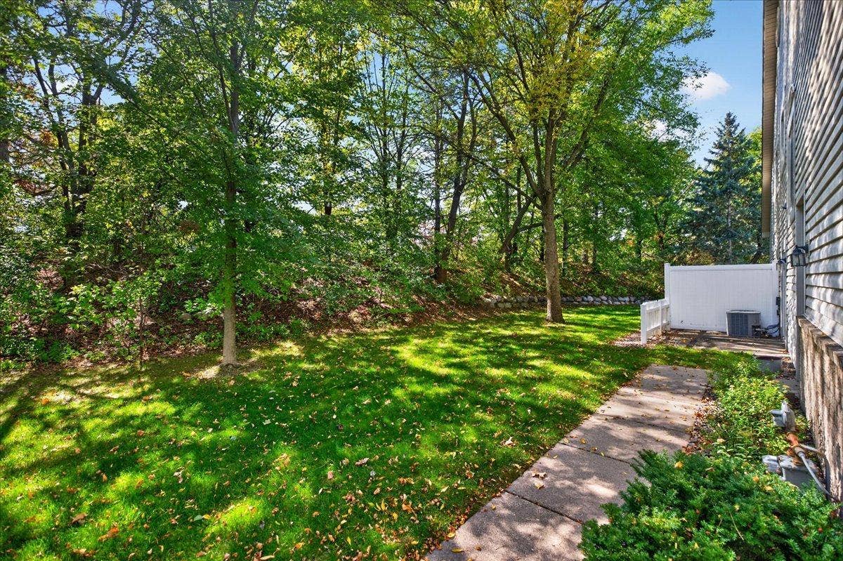 2583 Lockwood Drive, Mendota Heights, MN 55120 Enjoy a peaceful, wooded setting with mature trees and green space just outside your door.