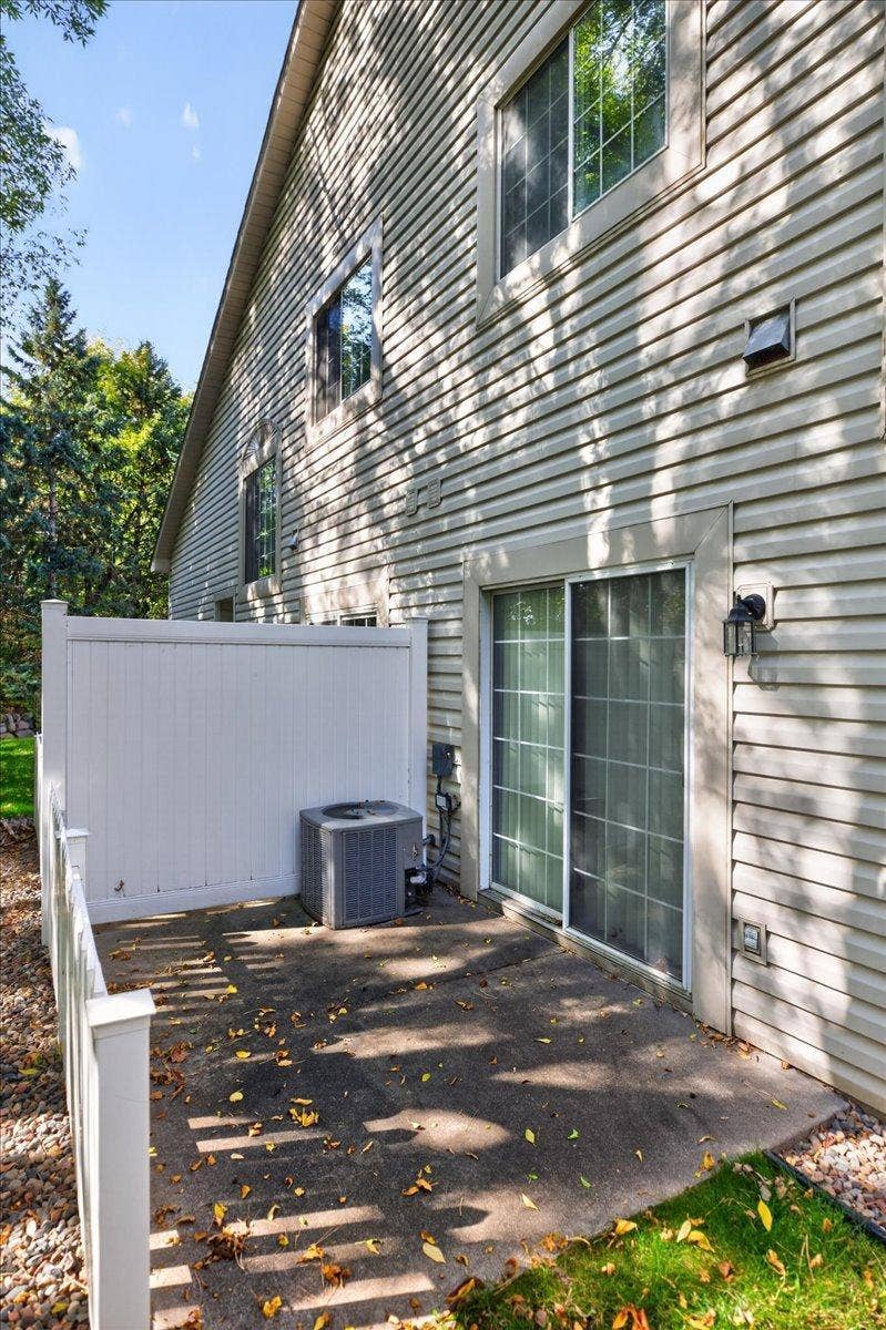 2583 Lockwood Drive, Mendota Heights, MN 55120 Private patio surrounded by mature treesperfect for relaxing or outdoor dining.