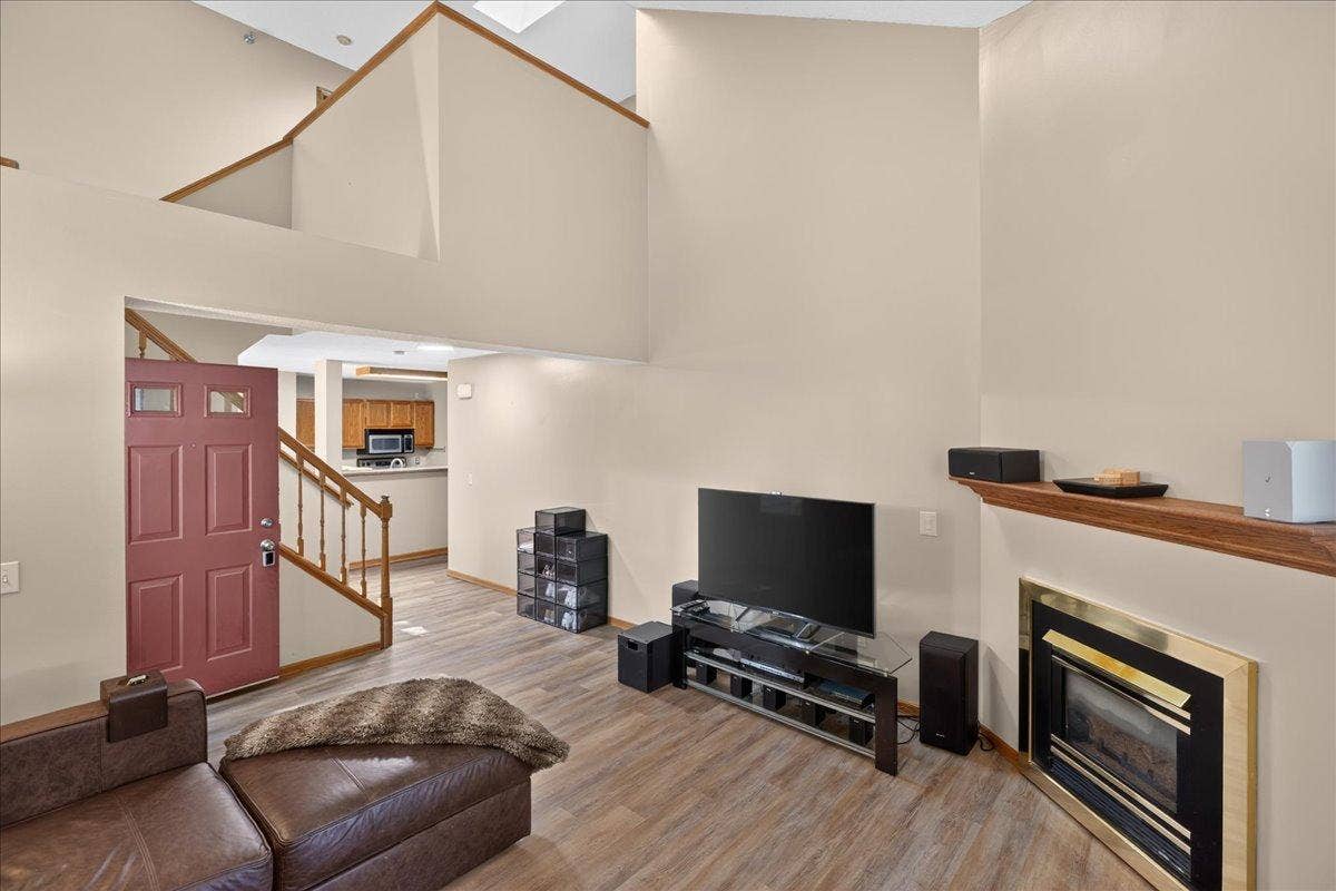 2583 Lockwood Drive, Mendota Heights, MN 55120 Open-concept living area showcases the dramatic ceiling height and upper-level overlook.