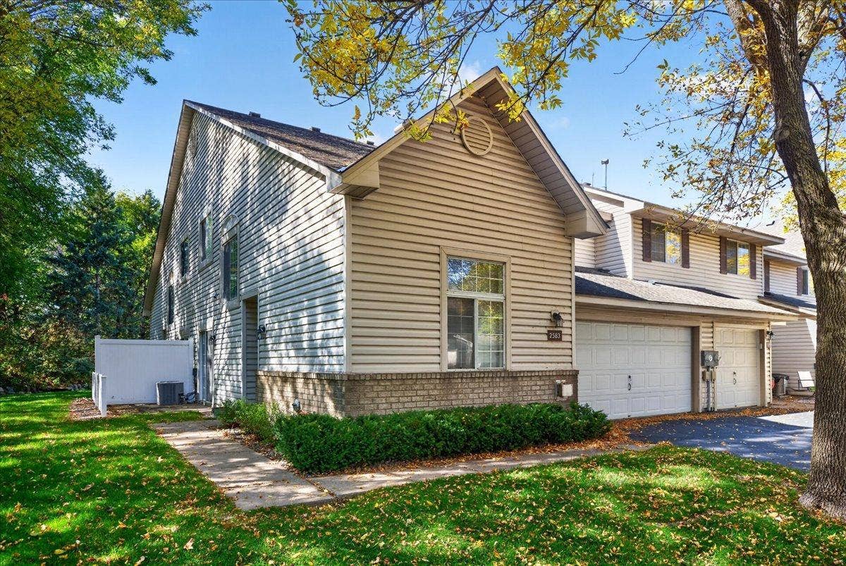 2583 Lockwood Drive, Mendota Heights, MN 55120 Desirable end-unit townhome tucked into a quiet, wooded setting in Mendota Heights.
