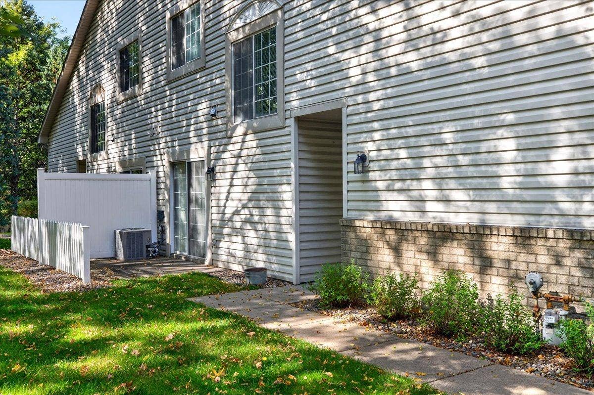 2583 Lockwood Drive, Mendota Heights, MN 55120 End-unit location offers added green space and beautiful mature trees.