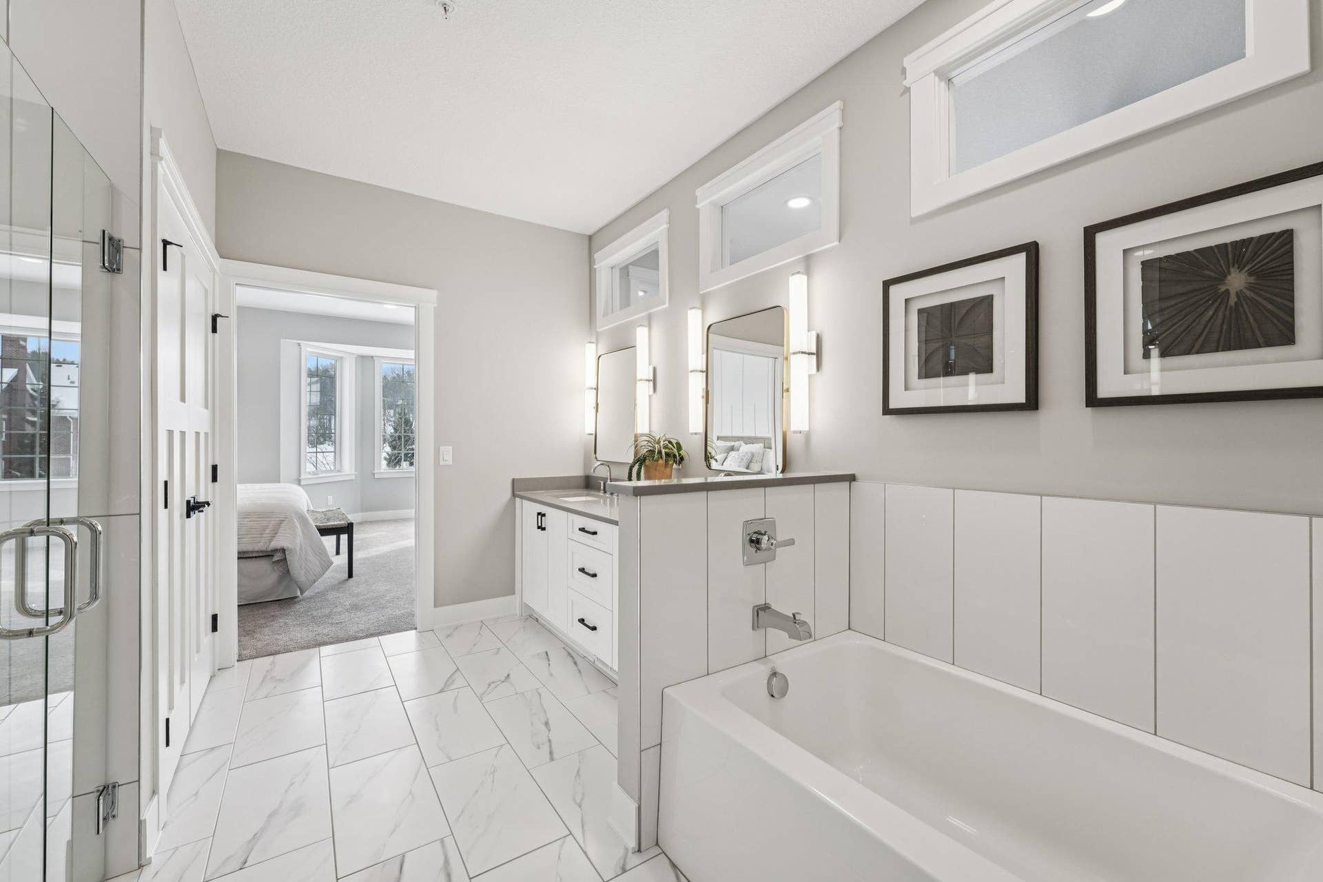 Relaxing soaking tub surrounded by elegant tilework and soft lightingideal for unwinding at the end of the day.