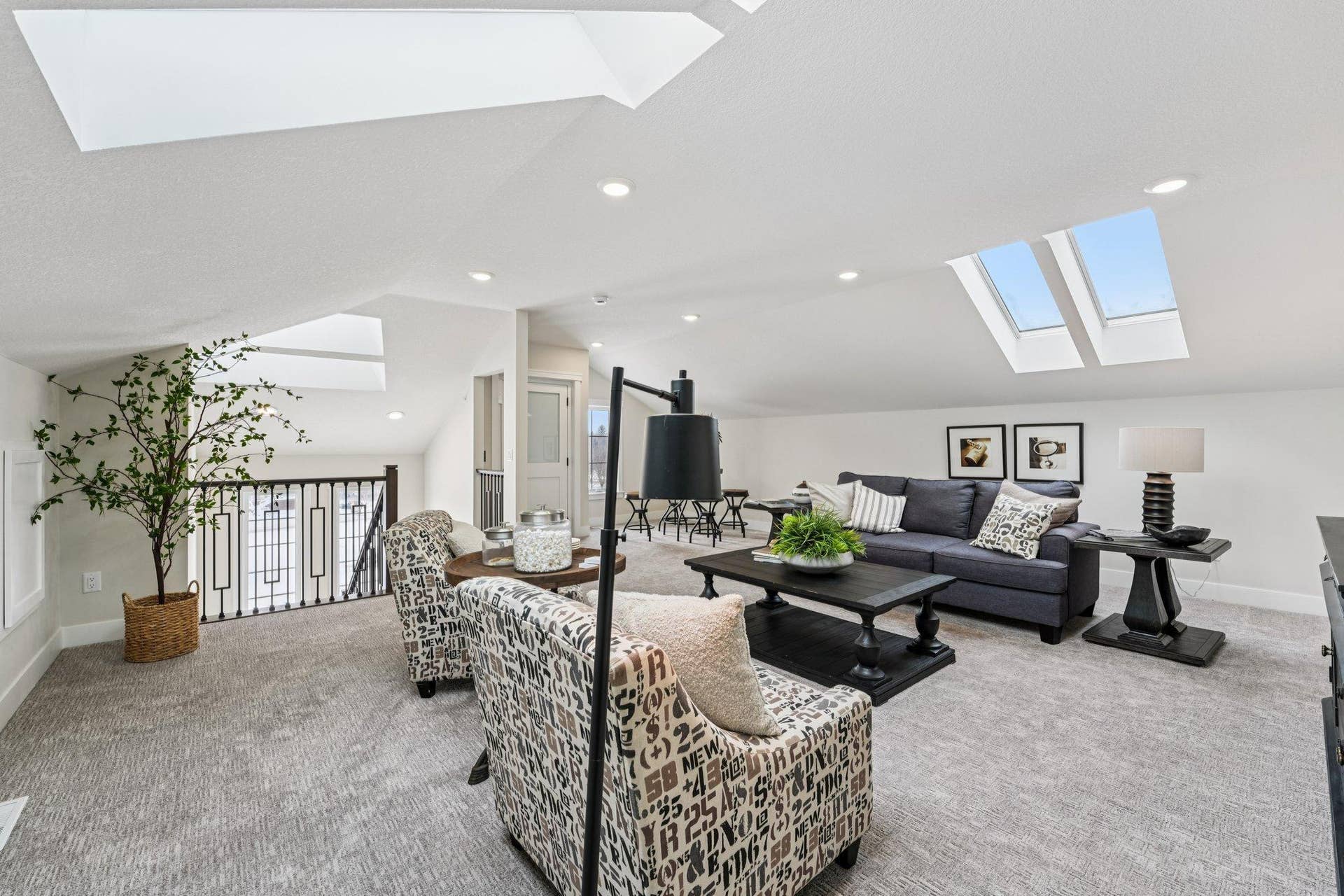 Another view of the upper-level loft highlighting abundant natural light, open sightlines, and versatile layout options.