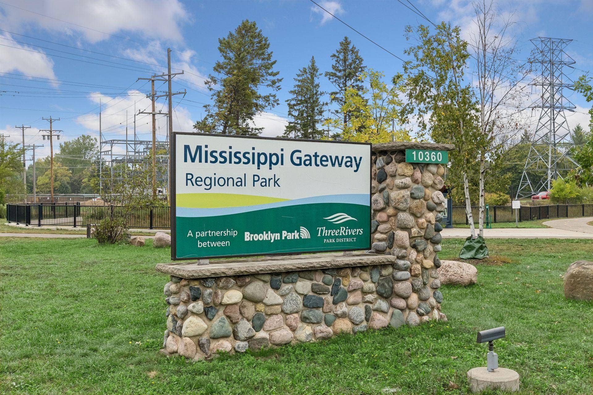 10571 Mississippi Circle N, Brooklyn Park, MN 55443 The home is steps away from a walking path that connects to the trails of Mississippi Gateway Regional Park (MGRP). Enjoy walking, biking, playgrounds, dog park, splash pad, boating, fishing, archery, showshoeing and classes at Gateway Center.