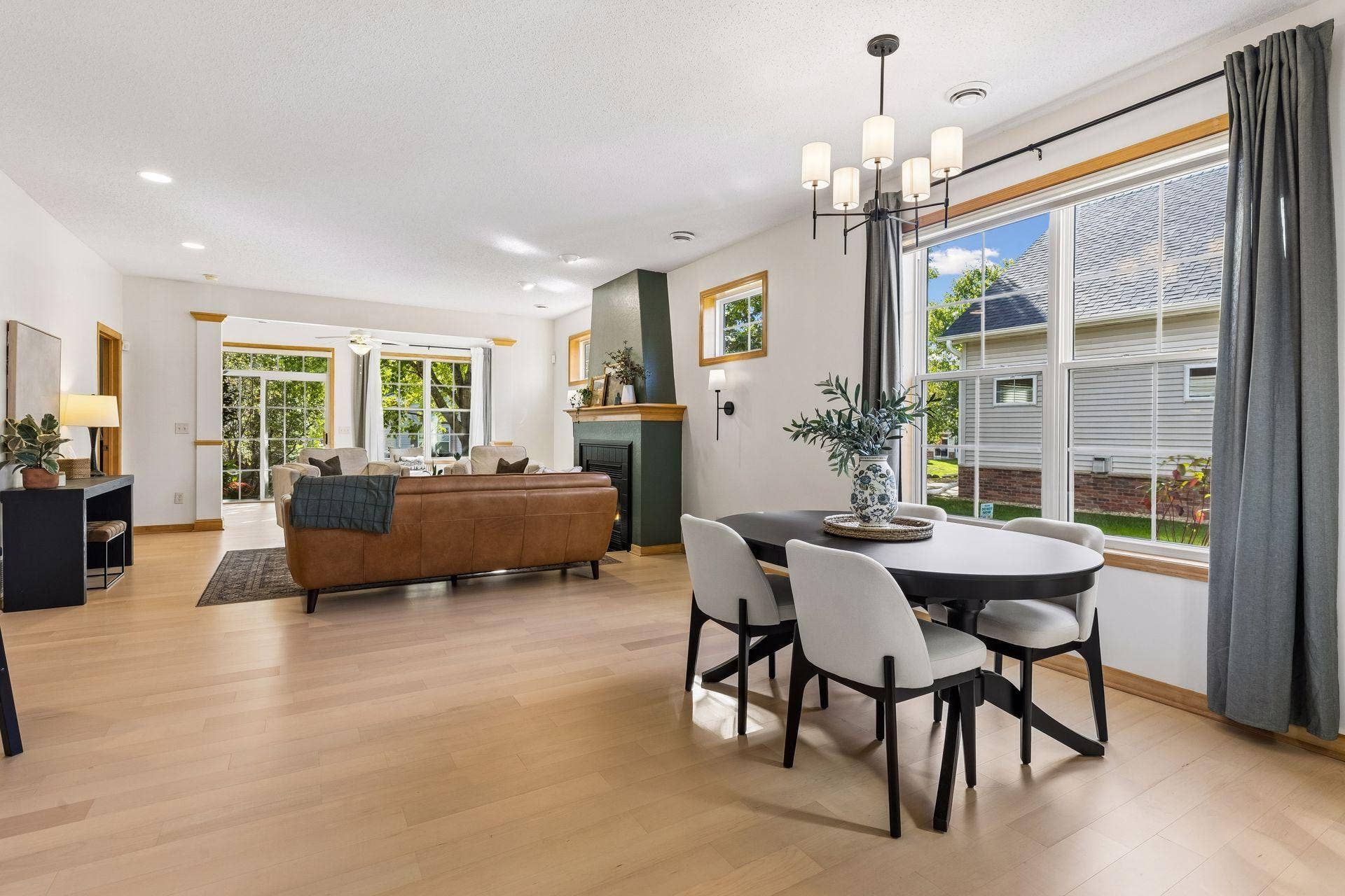 10571 Mississippi Circle N, Brooklyn Park, MN 55443 This large open concept living, dining, and sunroom with new LVP flooring is great for families and entertaining. The big beautiful windows fill the space with natural light.