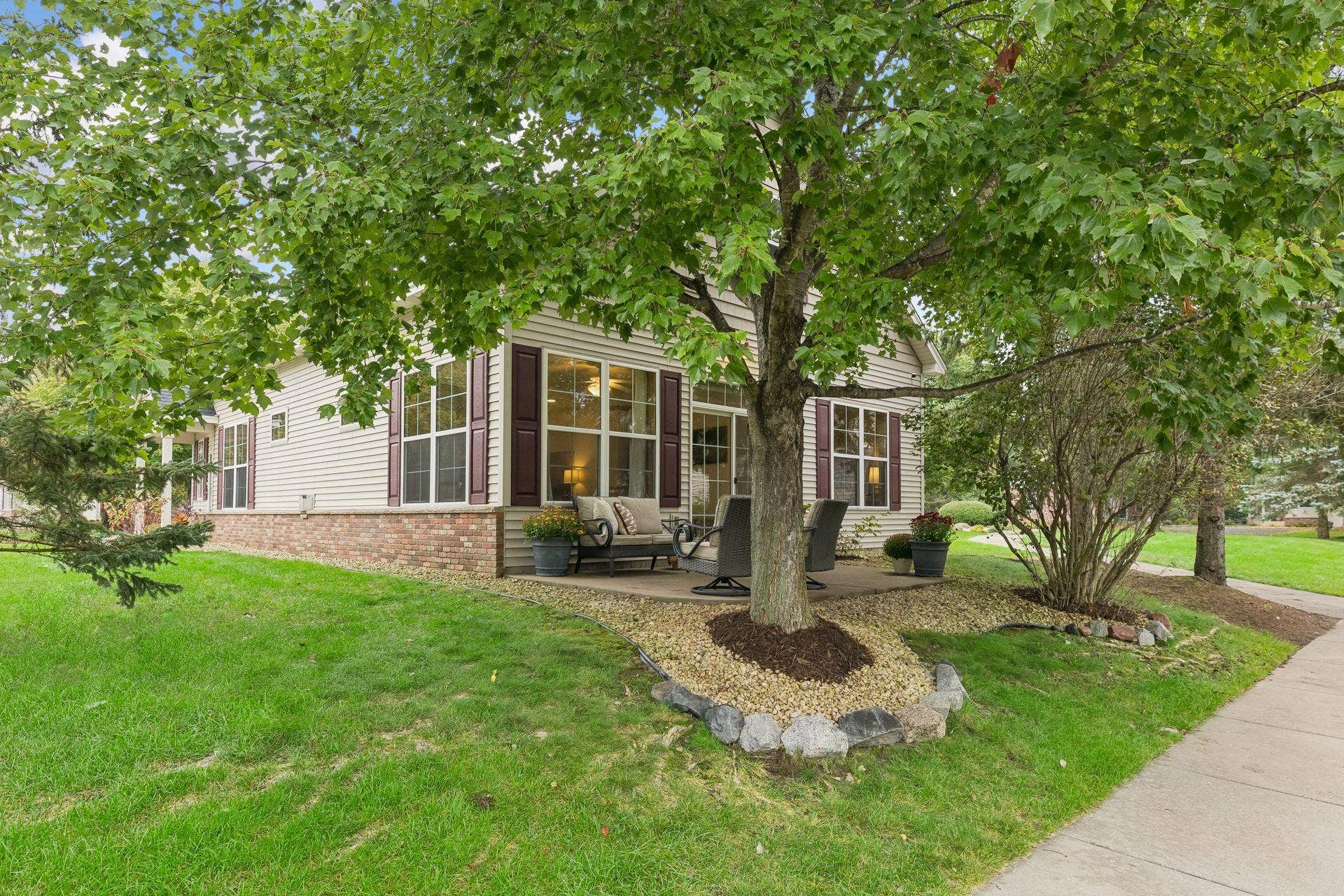 10571 Mississippi Circle N, Brooklyn Park, MN 55443 Relax on the patio under a canopy of lovely trees.