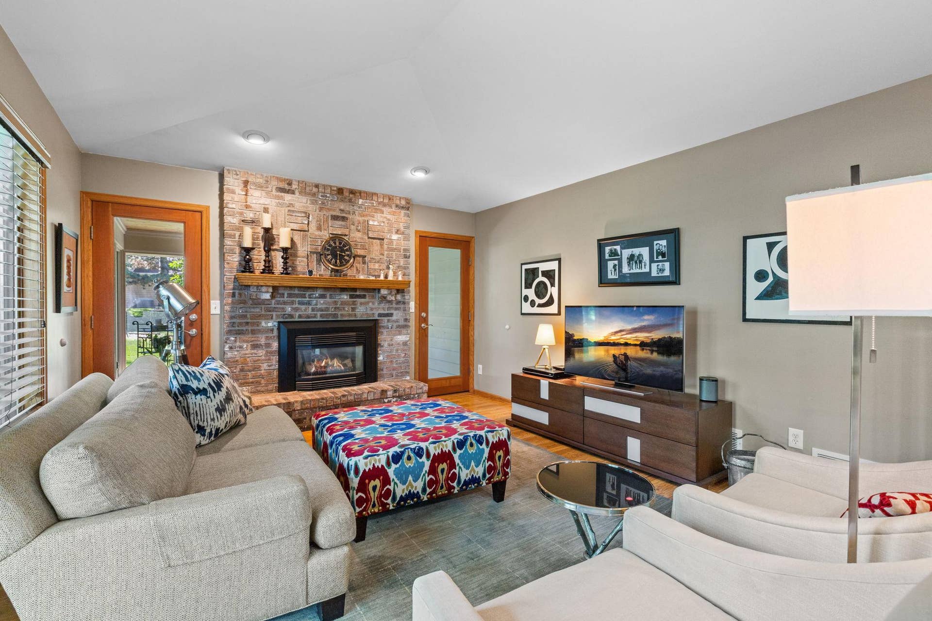 15393 Shadow Creek Road, Maple Grove, MN 55311 A beautiful floor-to-ceiling brick fireplace anchors the space.