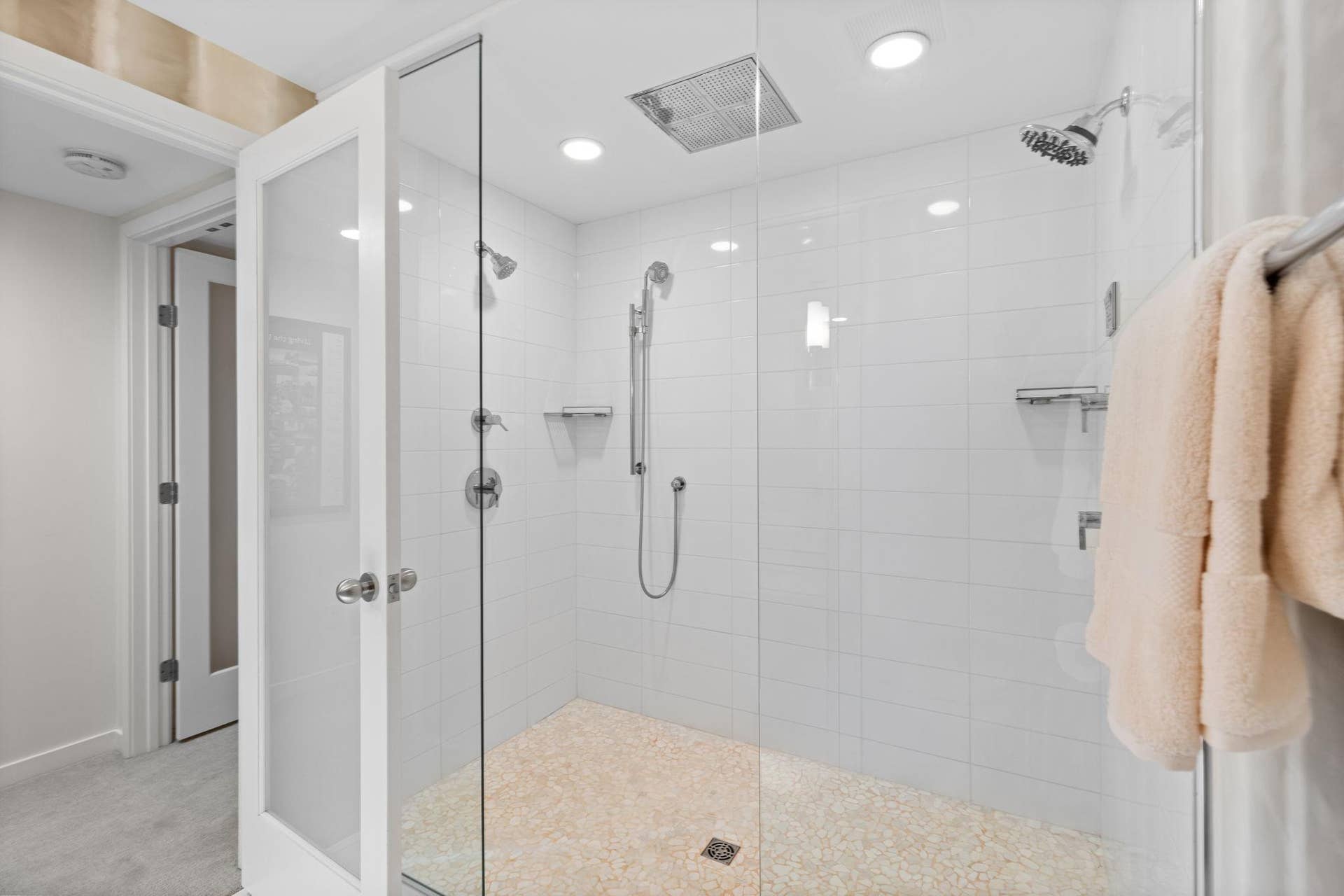 15393 Shadow Creek Road, Maple Grove, MN 55311 The adjacent bathroom feels spa-like with an expansive tiled walk-in rain shower with dual shower heads.