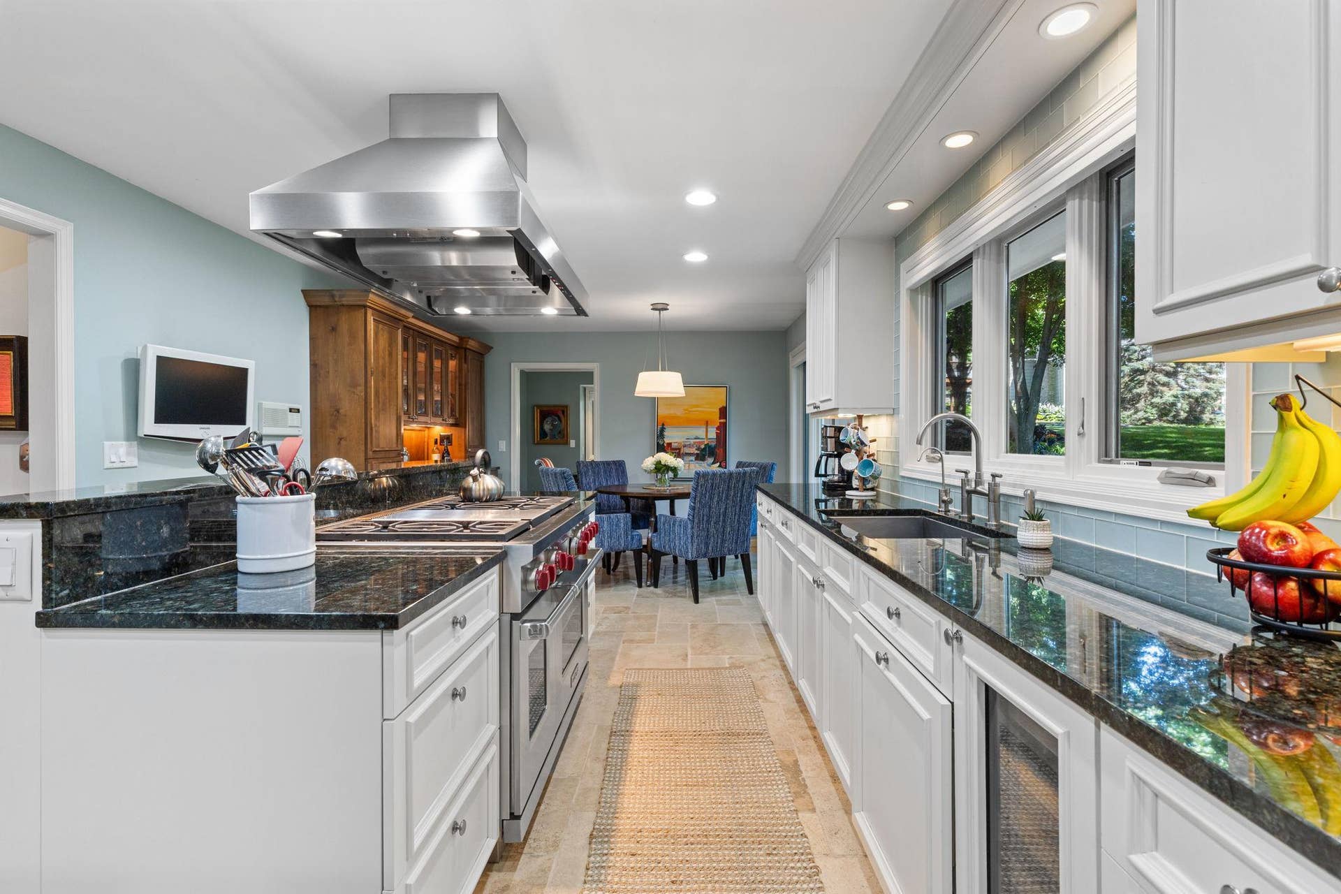 15393 Shadow Creek Road, Maple Grove, MN 55311 Designed for those who love to cook and entertain, it features stainless steel appliances including a high-end Wolf range.