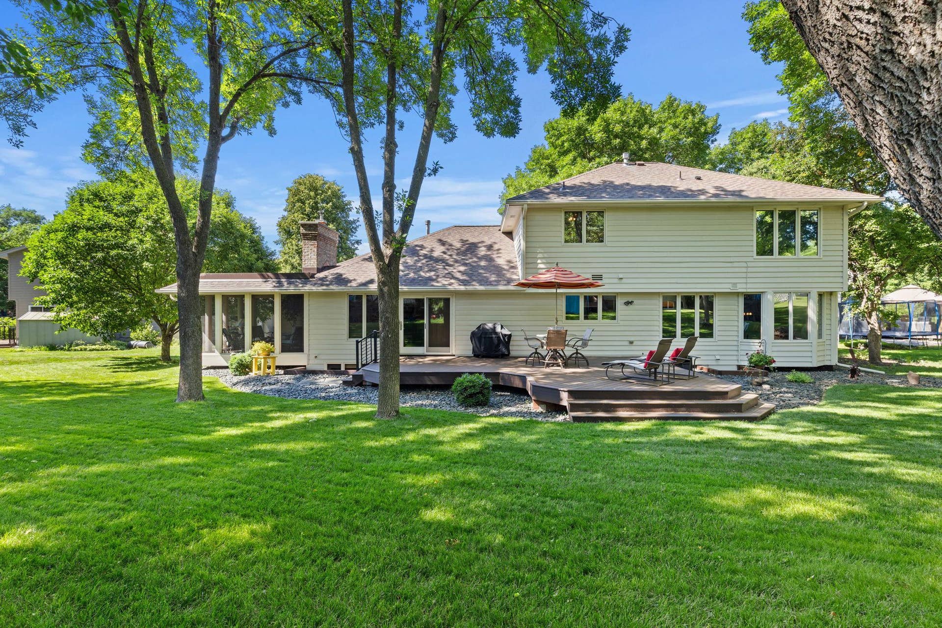 15393 Shadow Creek Road, Maple Grove, MN 55311 Additional improvements include a new patio door (2023), new roof (2022), leaf guard gutters, new chimney (2026), and privacy tint windows throughout select main living areas and the primary suite.