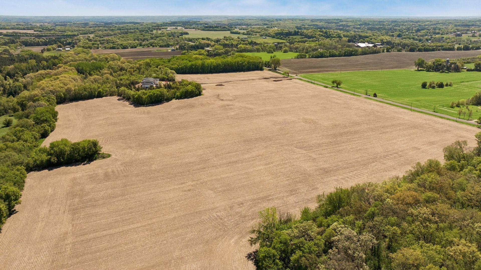 12150 S 15th Street, Afton, MN 55001 Whether you envision a stately custom estate, a modern farmhouse, or a private retreat tucked among the trees, this extraordinary property offers the space and setting to bring your vision to life.