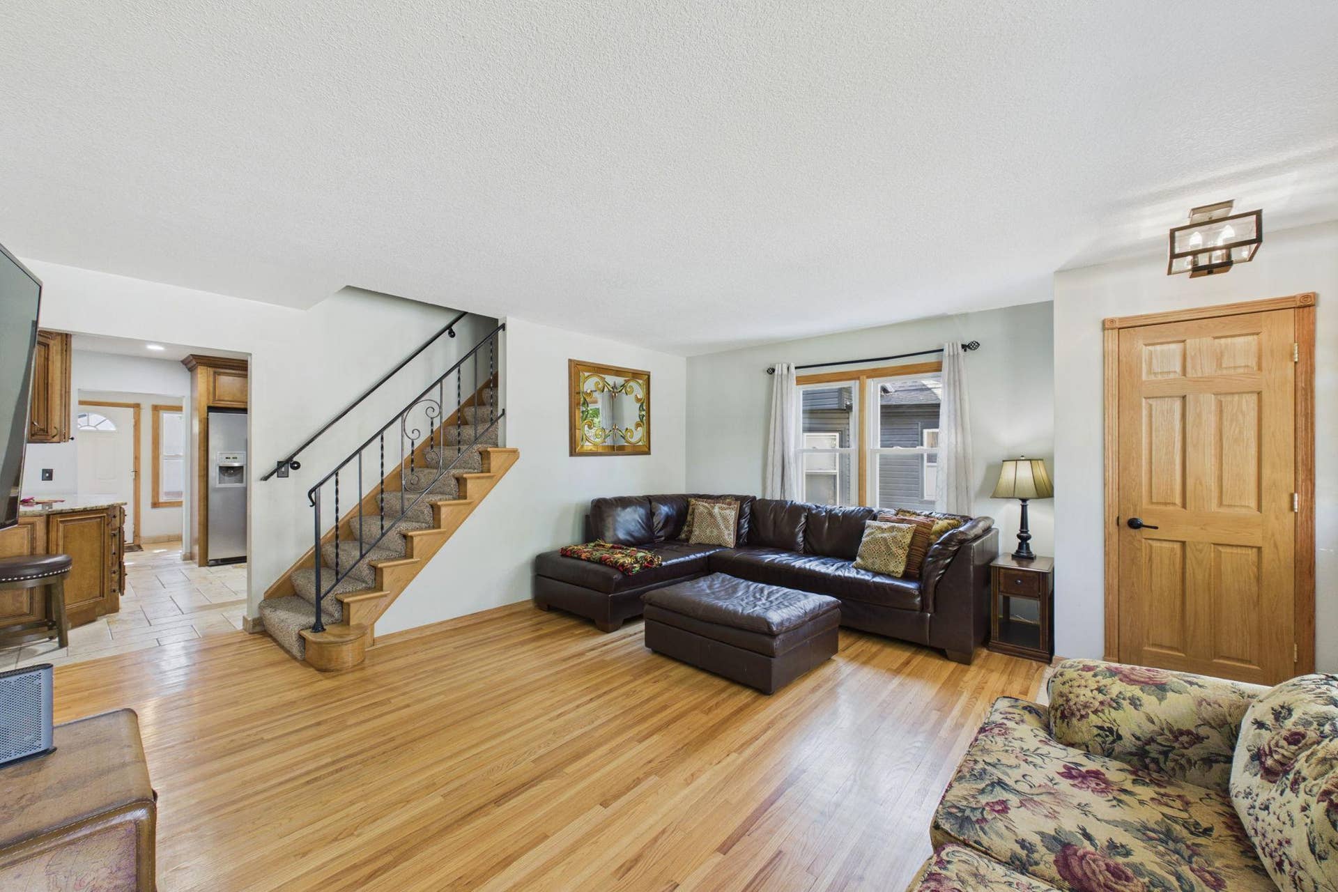 186 Hurley Street E, West Saint Paul, MN 55118 Living room in the main level with stairs leading to upper primary ensuite