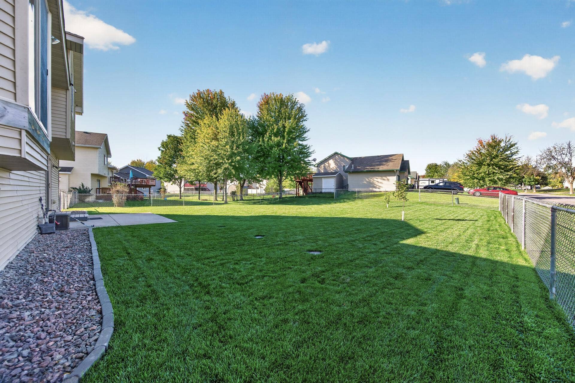 3765 Woodside Drive, Monticello, MN 55362 Spacious fully fenced backyard with a beautifully maintained lawn and plenty of room to relax, play, or entertain.