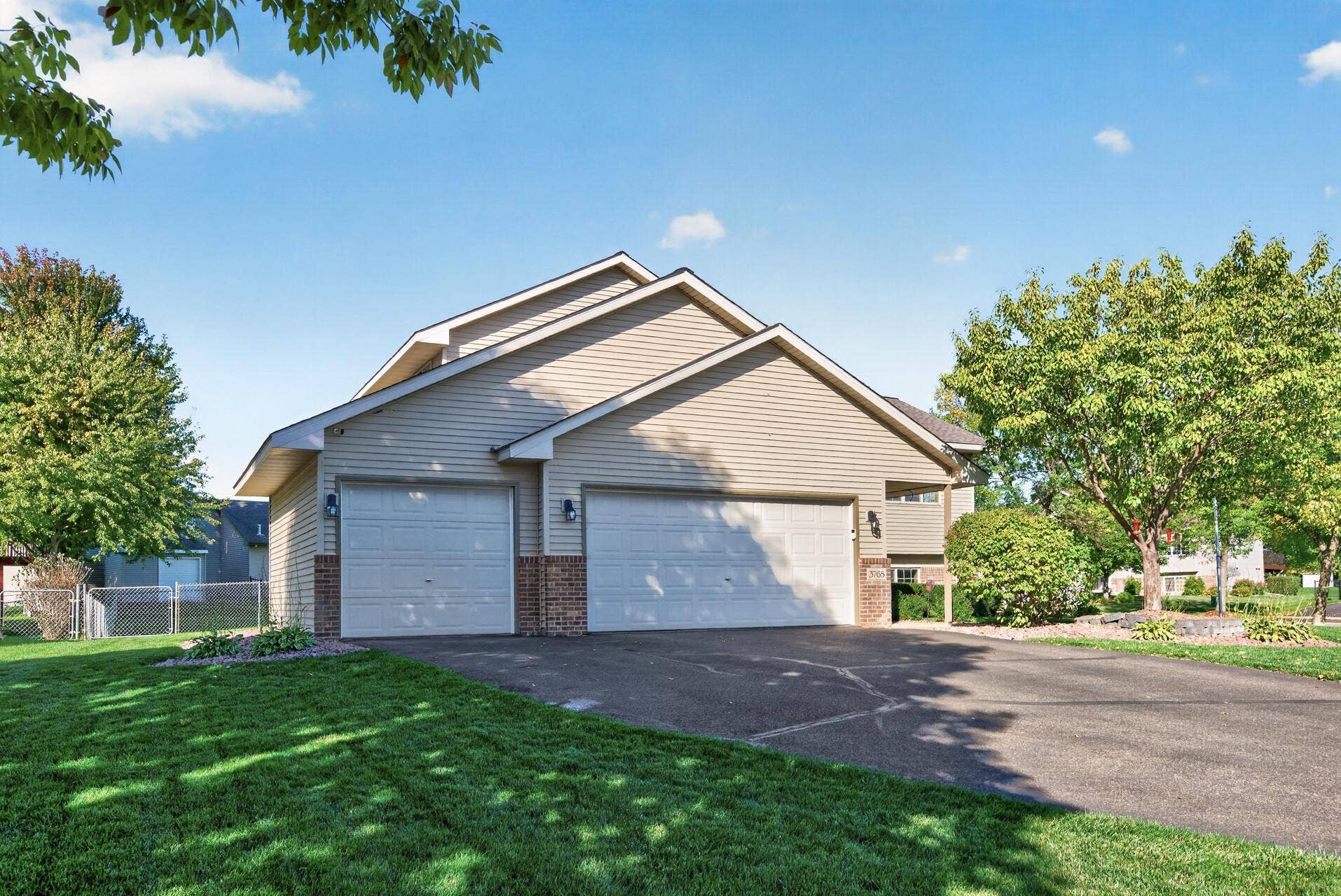 3765 Woodside Drive, Monticello, MN 55362 Oversized three-car garage with plenty of room for vehicles, storage, and all the extras!