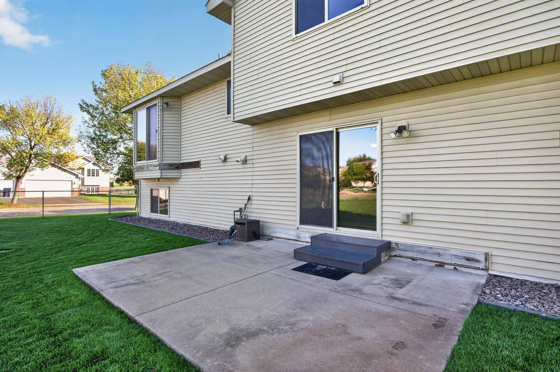 3765 Woodside Drive, Monticello, MN 55362 Spacious backyard patio provides plenty of room for outdoor dining, grilling and entertaining, all overlooking the large, fully fenced backyard.
