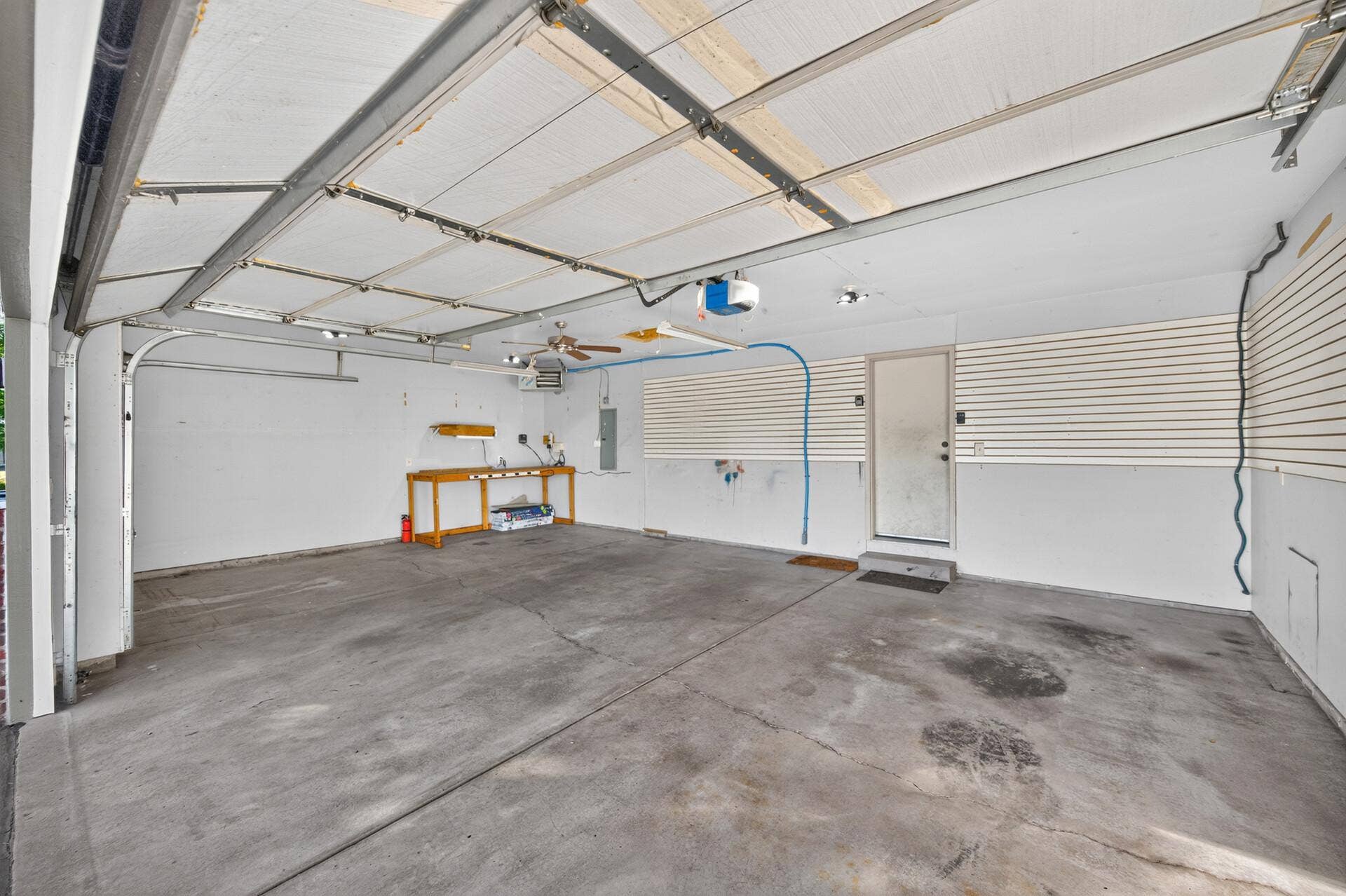 3765 Woodside Drive, Monticello, MN 55362 Oversized three-car heated and insulated garage with plenty of room for vehicles, storage and a workbenchplus wall-mounted storage panels and convenient access to the home.