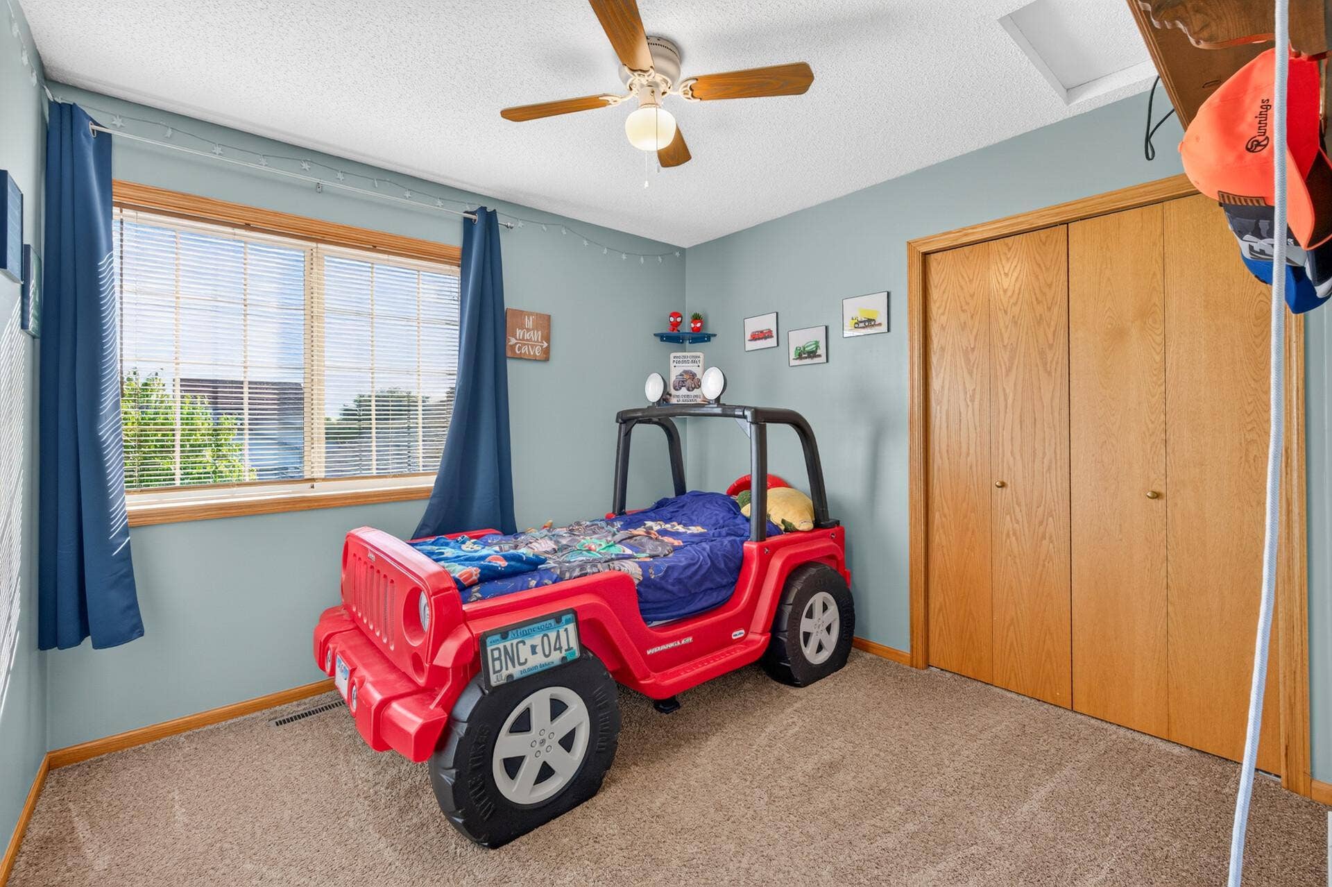 3765 Woodside Drive, Monticello, MN 55362 Third upper-level bedroom featuring a ceiling fan, generous closet space, with large window and abundant natural light.