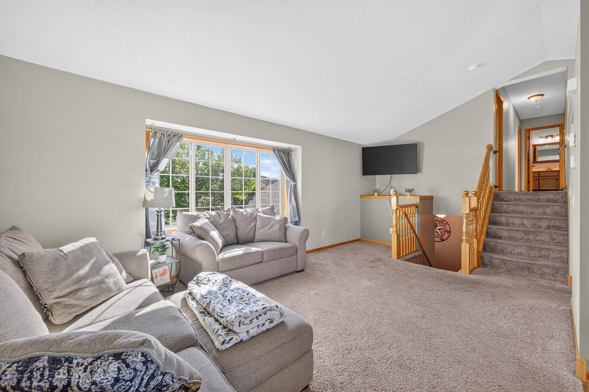 3765 Woodside Drive, Monticello, MN 55362 Sun-filled living room with vaulted ceiling and large picture window overlooking the front yard.