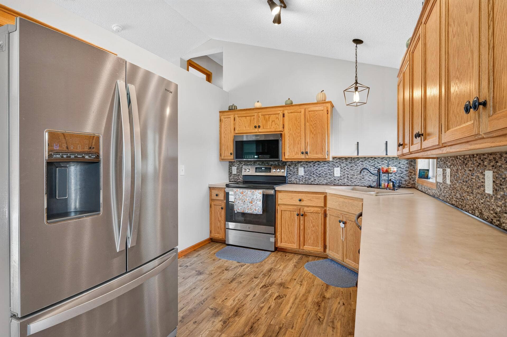 3765 Woodside Drive, Monticello, MN 55362 Spacious kitchen with abundant cabinetry, generous counter space, and stainless-steel appliances.