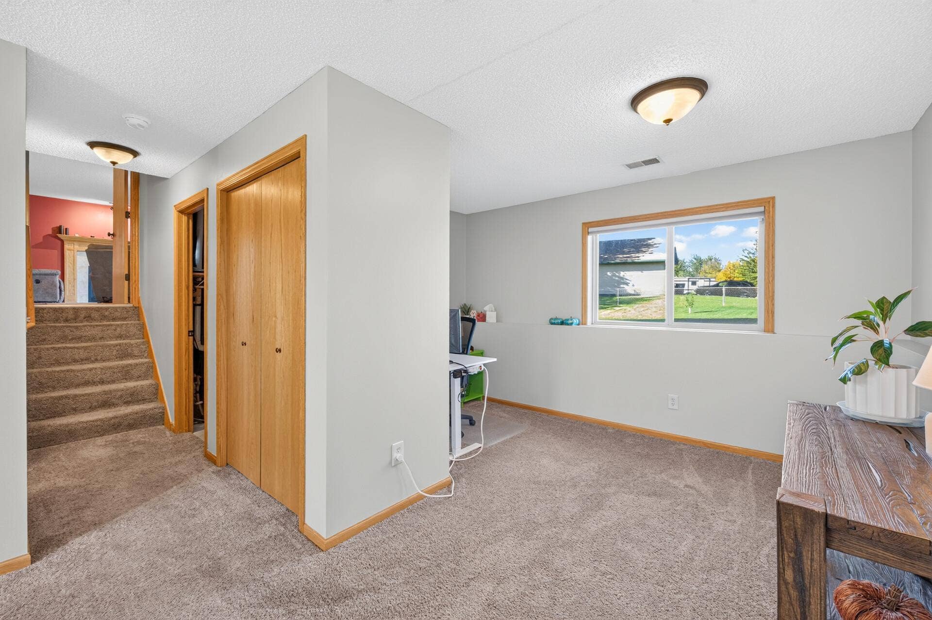 3765 Woodside Drive, Monticello, MN 55362 Spacious lower-level flex area offers plenty of room for a home office, play area, or additional living space.