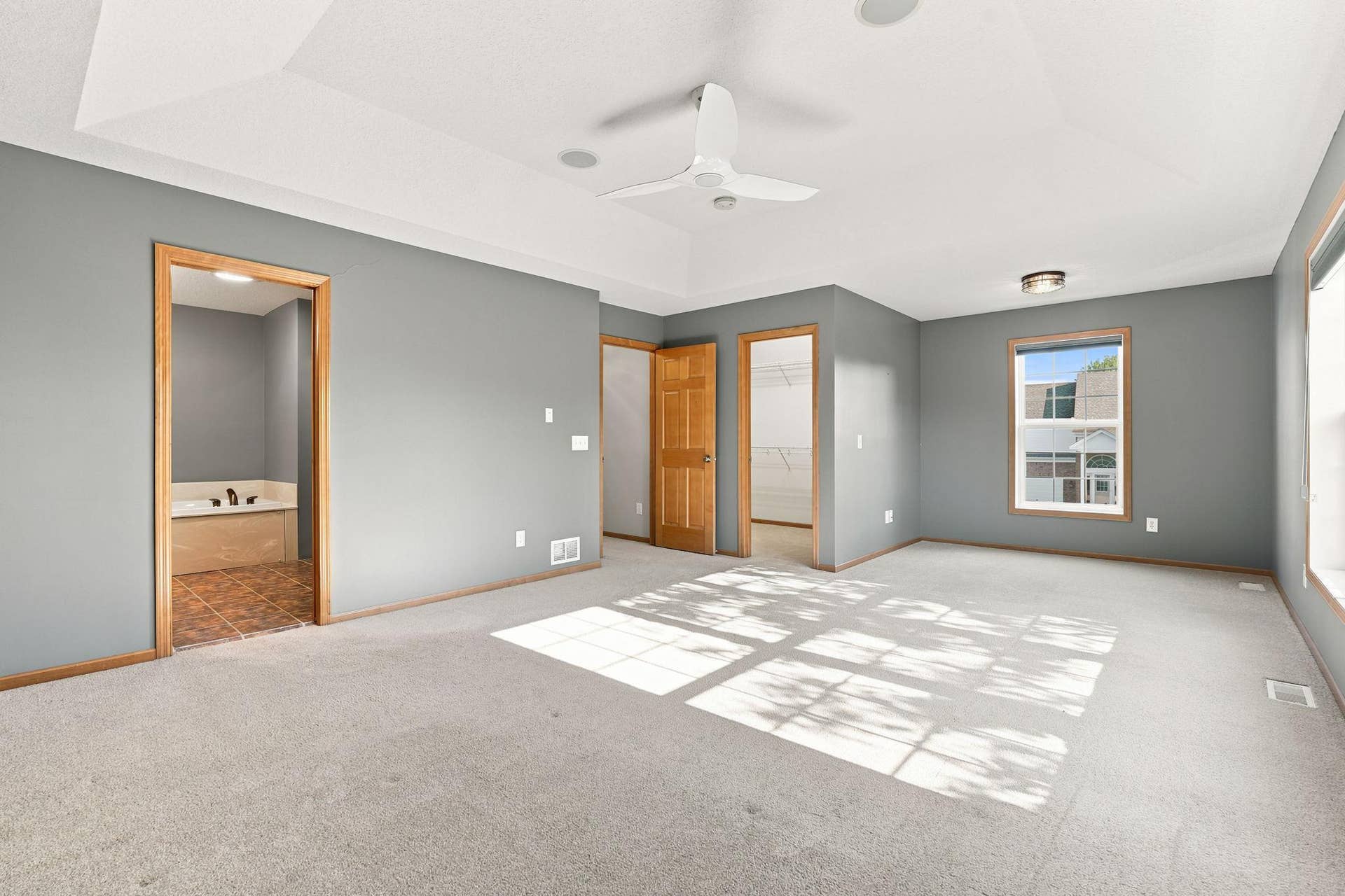 7143 Arthur Drive, Woodbury, MN 55125 Primary bedroom with full bath ensuite and large walk-in closet.