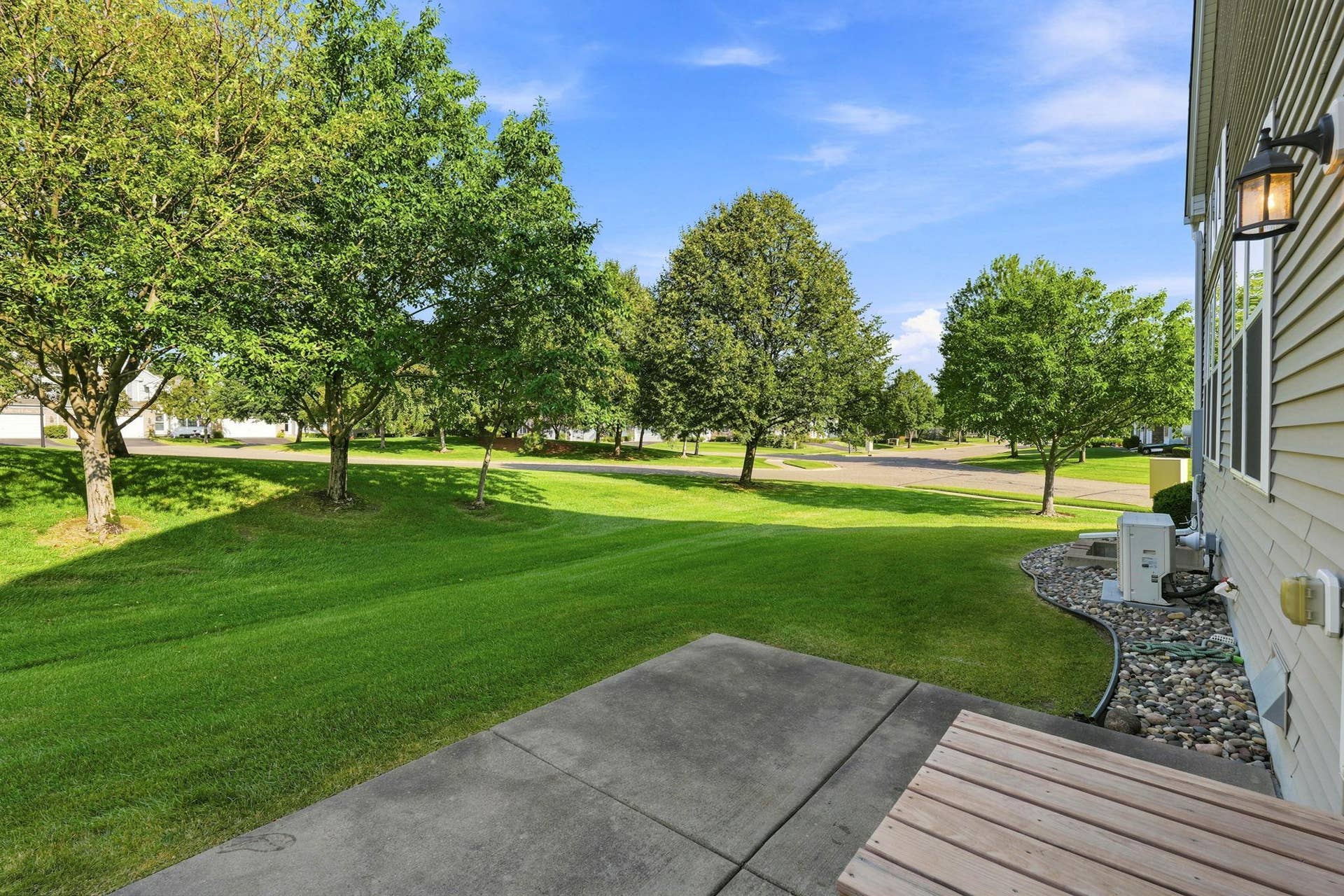 7143 Arthur Drive, Woodbury, MN 55125 Relax on the patio and enjoy the yard. A major benefit of owning this end-unit town home.