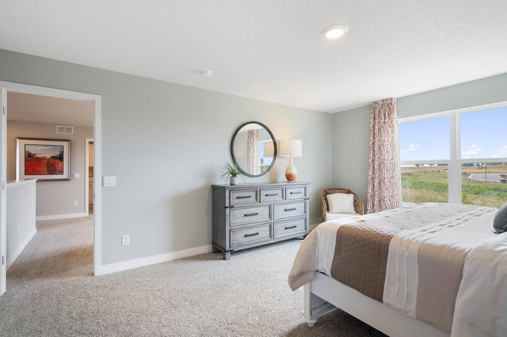 4774 Blake Court, Woodbury, MN 55129 Primary bedroom has large windows and private full bathroom.