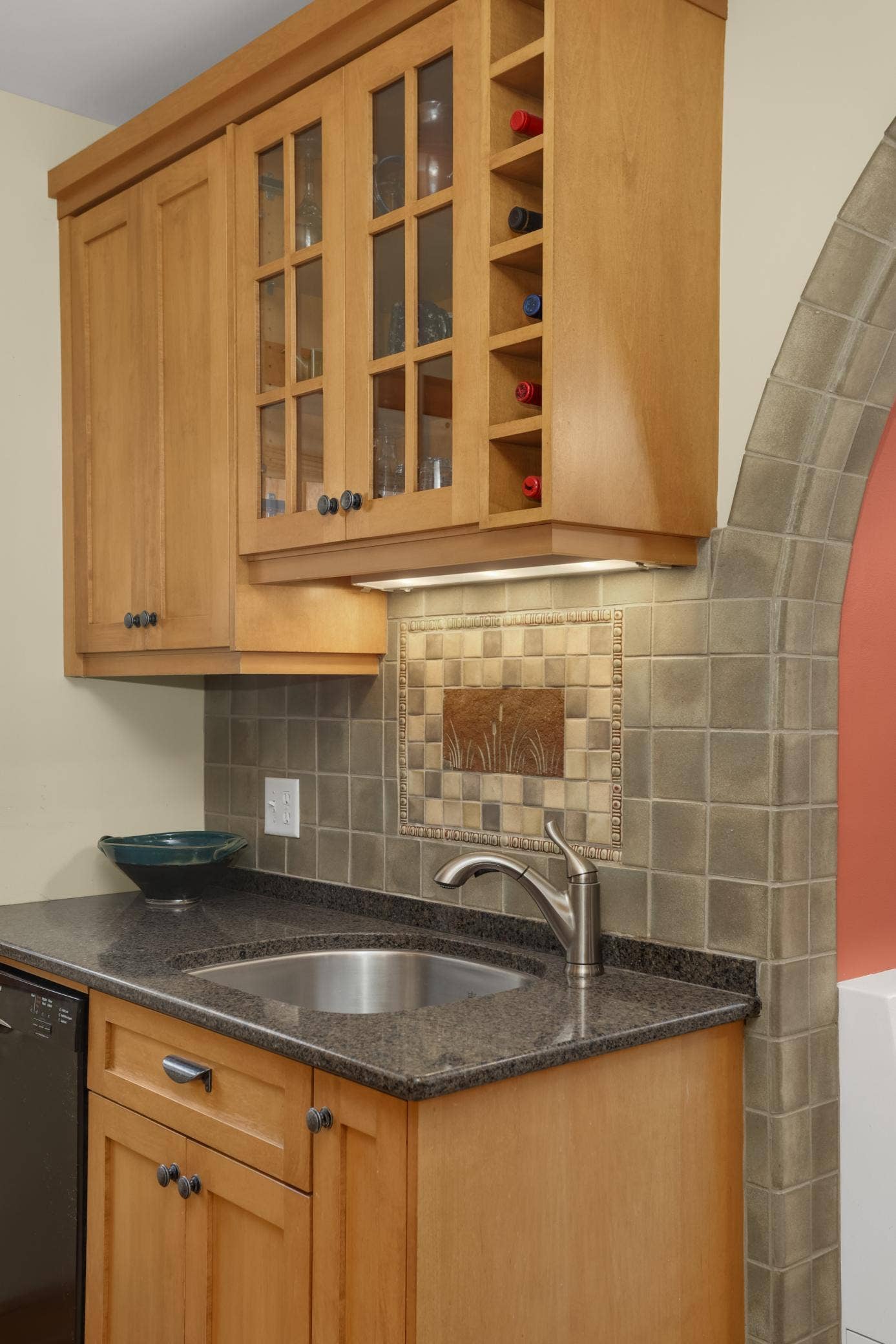 The beautifully updated kitchen is a true highlight of this gorgeous home, including custom cabinetry and tile