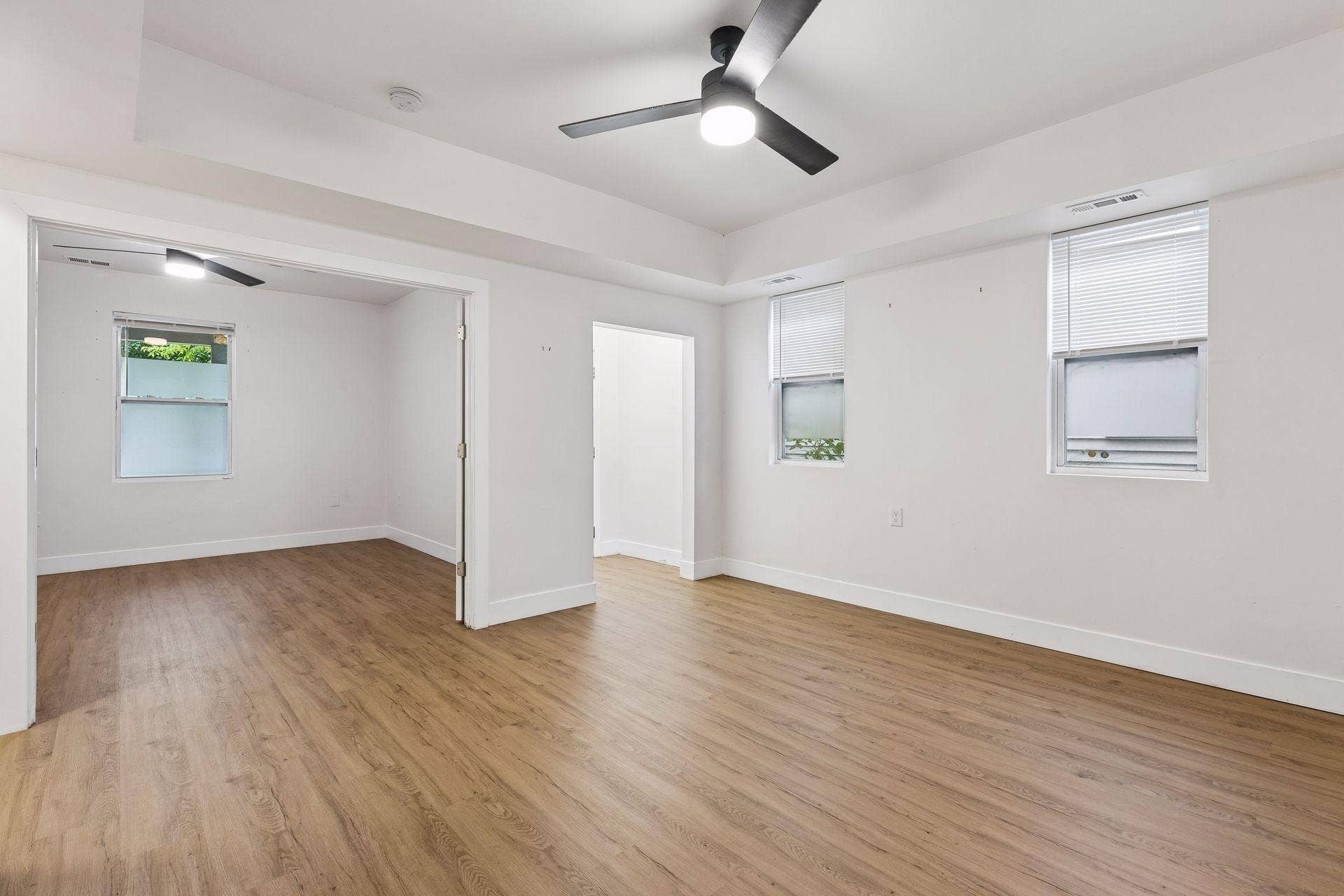 2533 Polk Street NE, 2, Minneapolis, MN 55418 Unit 1: French doors connect the living room to the spacious main-floor bedroom, creating an easy flow between the two spaces.