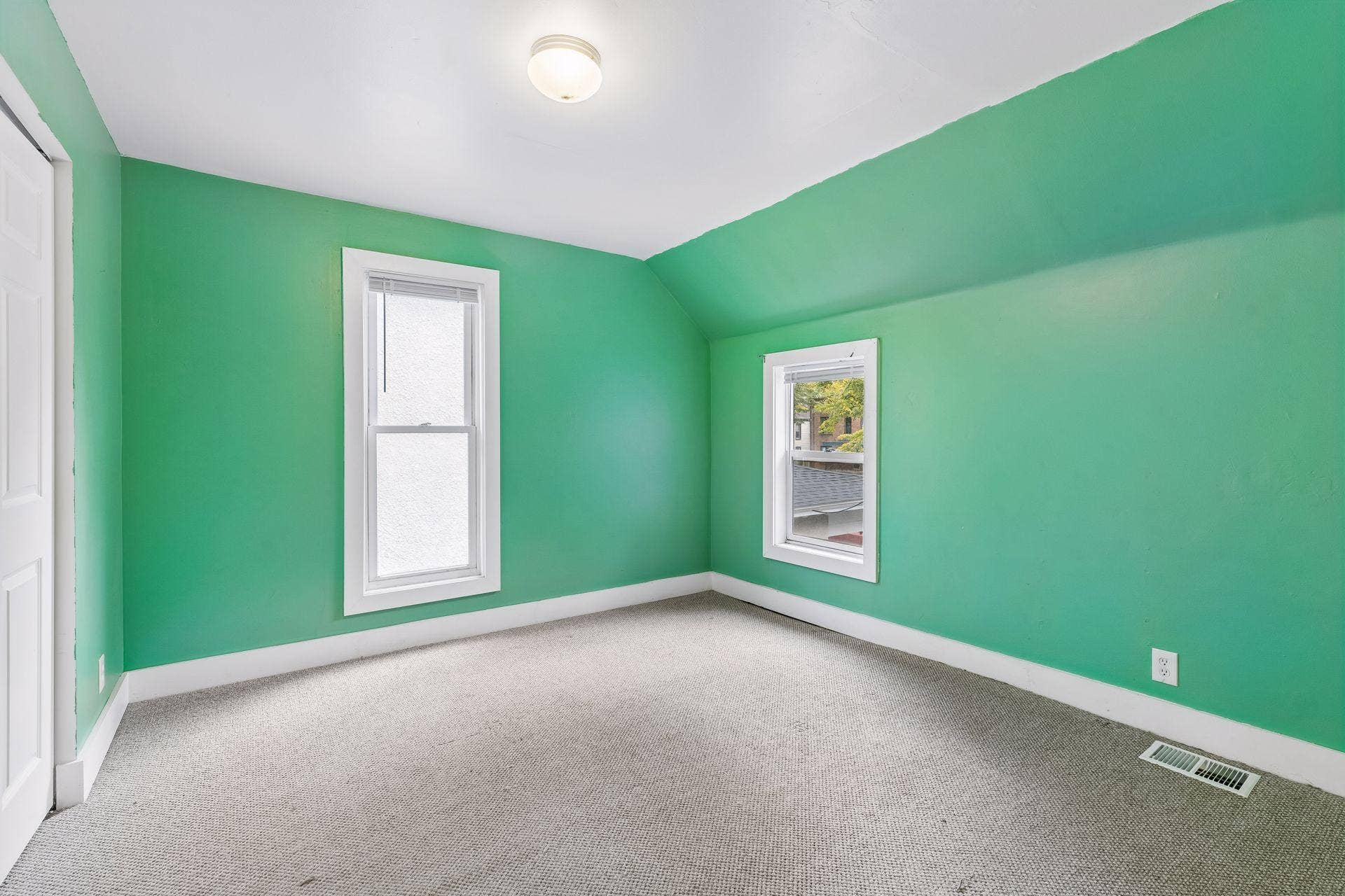 2533 Polk Street NE, 2, Minneapolis, MN 55418 Unit 2: The second upper-level bedroom features carpet flooring, overhead lighting, and windows that bring in natural light.