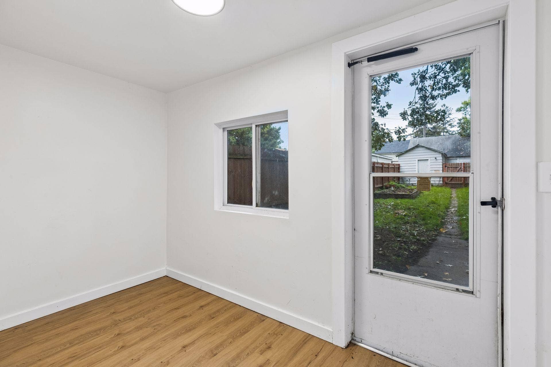 2533 Polk Street NE, 2, Minneapolis, MN 55418 Unit 1: A spacious back porch extends to the outdoor living space and provides easy access to the backyard.