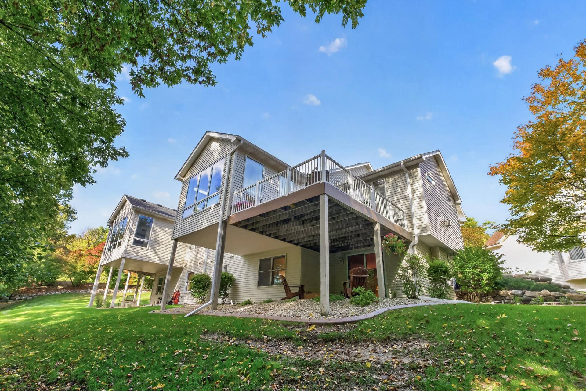 7982 Dunkirk Lane N, Maple Grove, MN 55311 Elevated deck showcases the wooded backdrop.