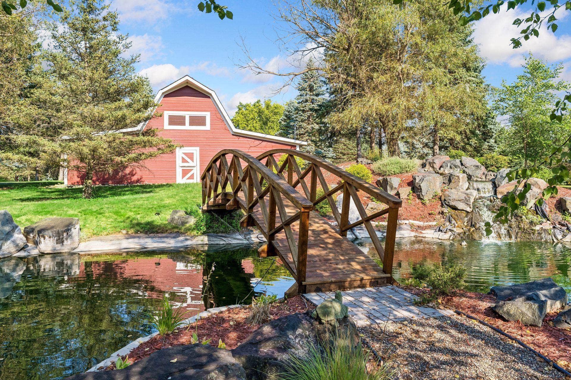 Arched footbridge leading toward the Civil War era barn