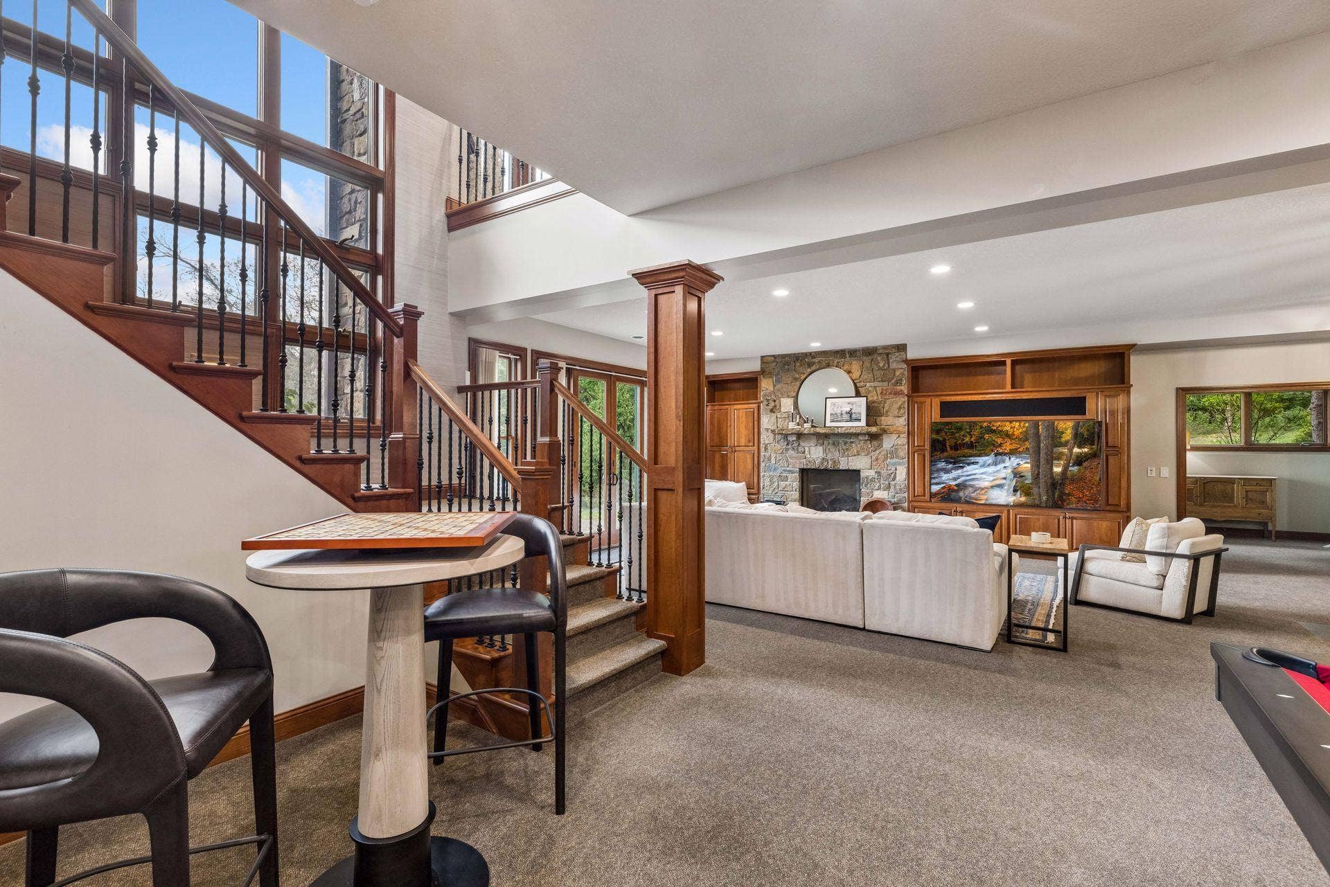 Entertainment-ready rec room with wet bar, billiards area and room to gather