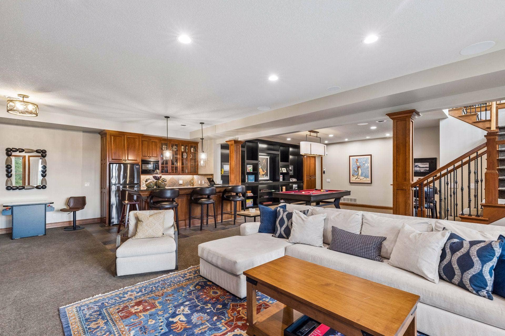 Entertainment-ready rec room with wet bar, billiards area and room to gather