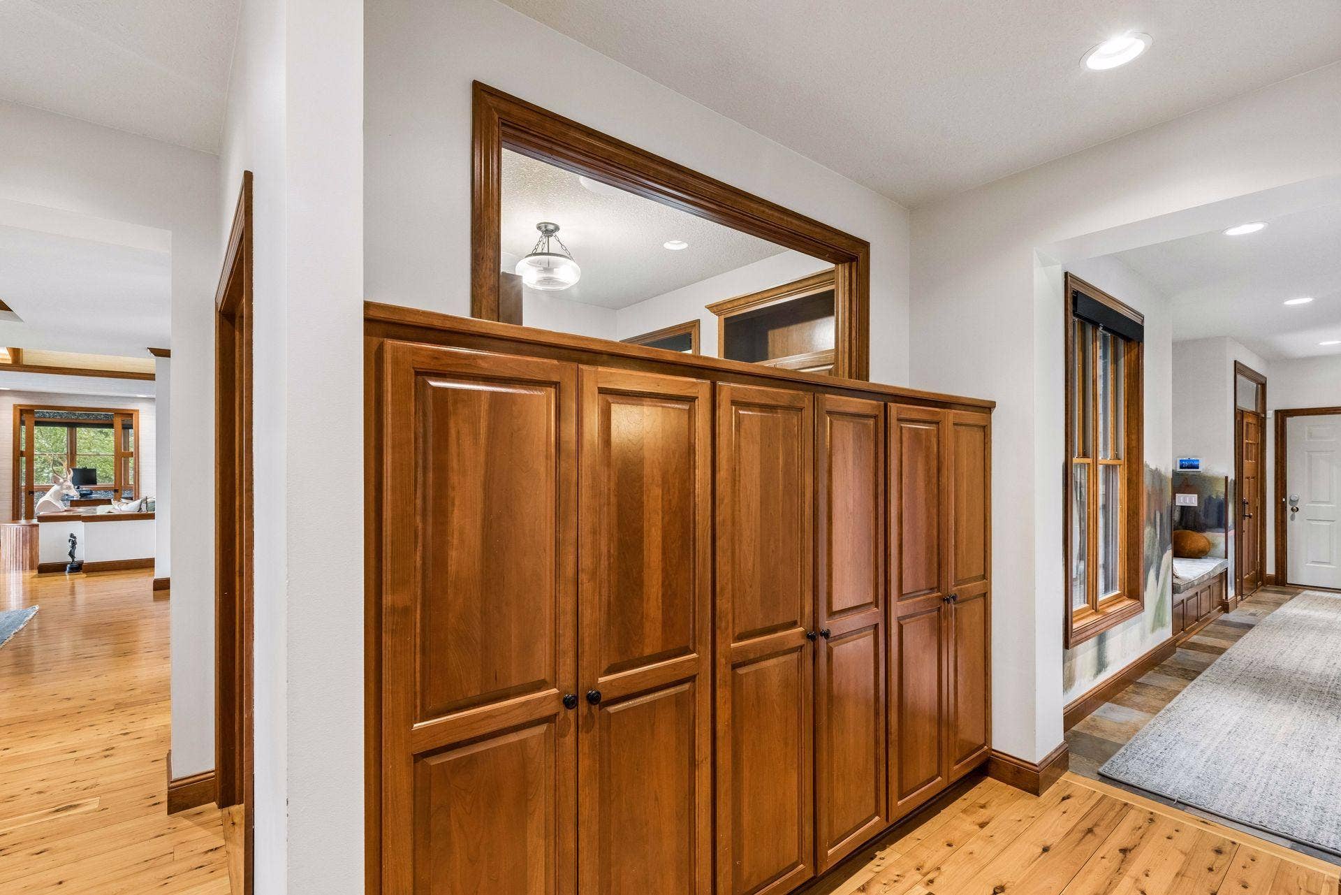 Custom cabinetry storage options abound throughout the home