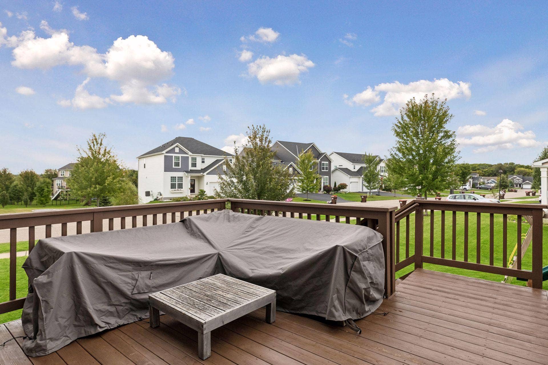 9135 Lighthouse Lane, Woodbury, MN 55129 9135 Lighthouse Lane - Large Deck with stairs overlooking expansive corner lot