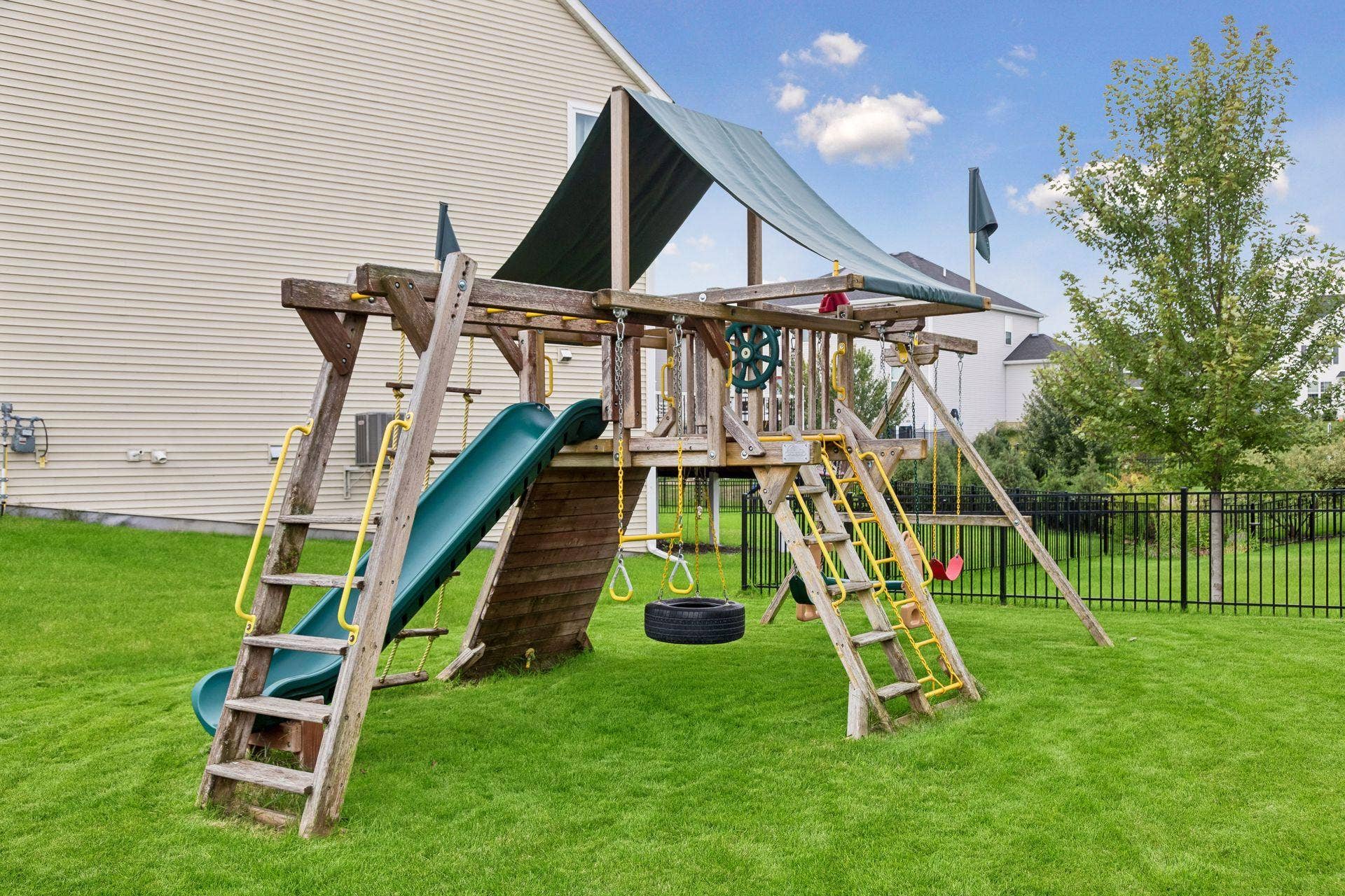 9135 Lighthouse Lane, Woodbury, MN 55129 Large yard with swing set which can be left with home if desired.