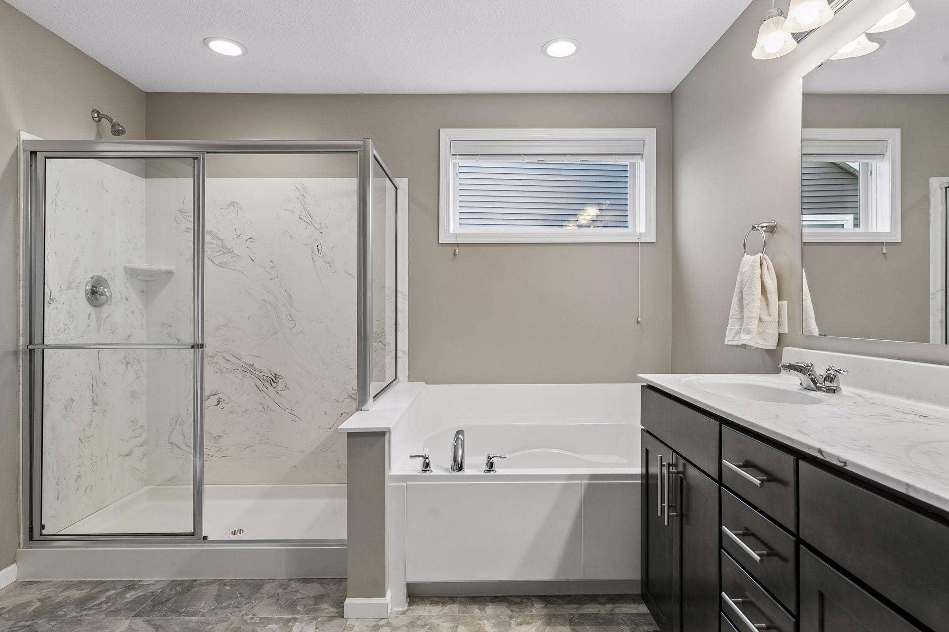 9135 Lighthouse Lane, Woodbury, MN 55129 Primary bath features separate tub and shower