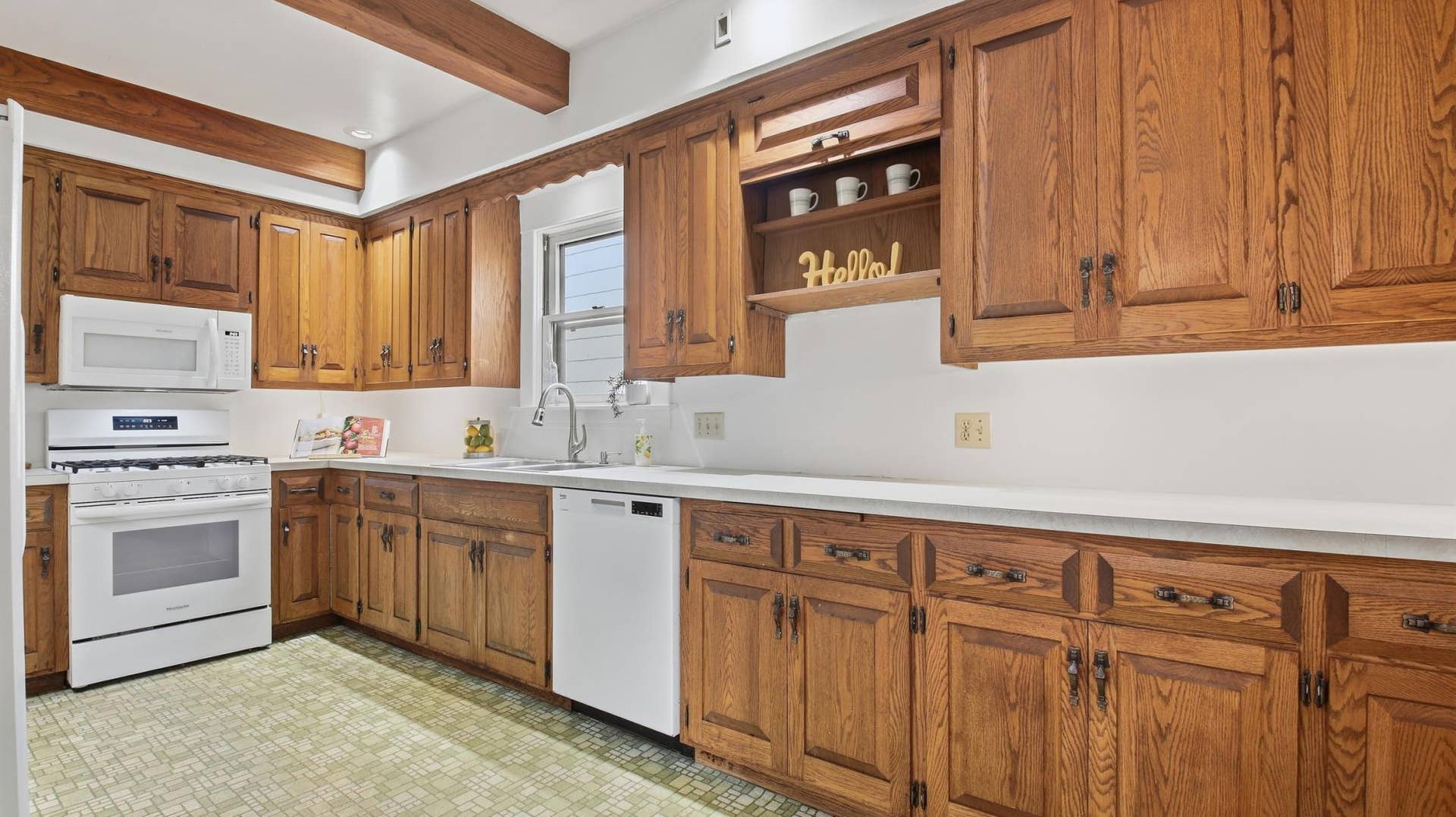 820 5th Avenue SE, 50, Minneapolis, MN 55414 The kitchen with its ample cabinetry and new gas range, microwave, and dishwasher (2025).
