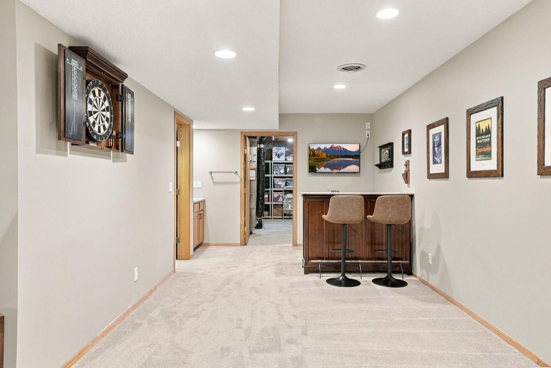 The lower level recreation room includes a bar