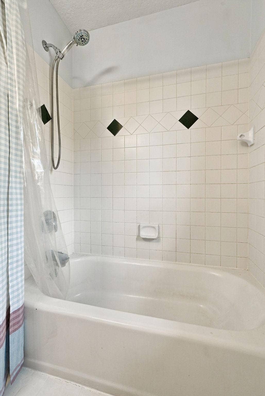 Bathtub in full sized bathroom on upper level
