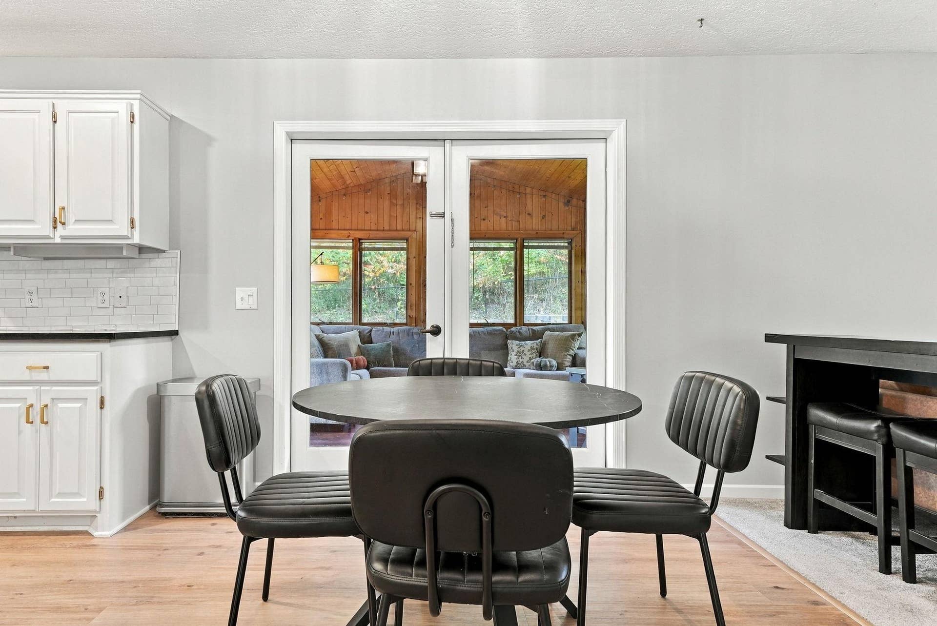 Kitchen looking into the four-season porch