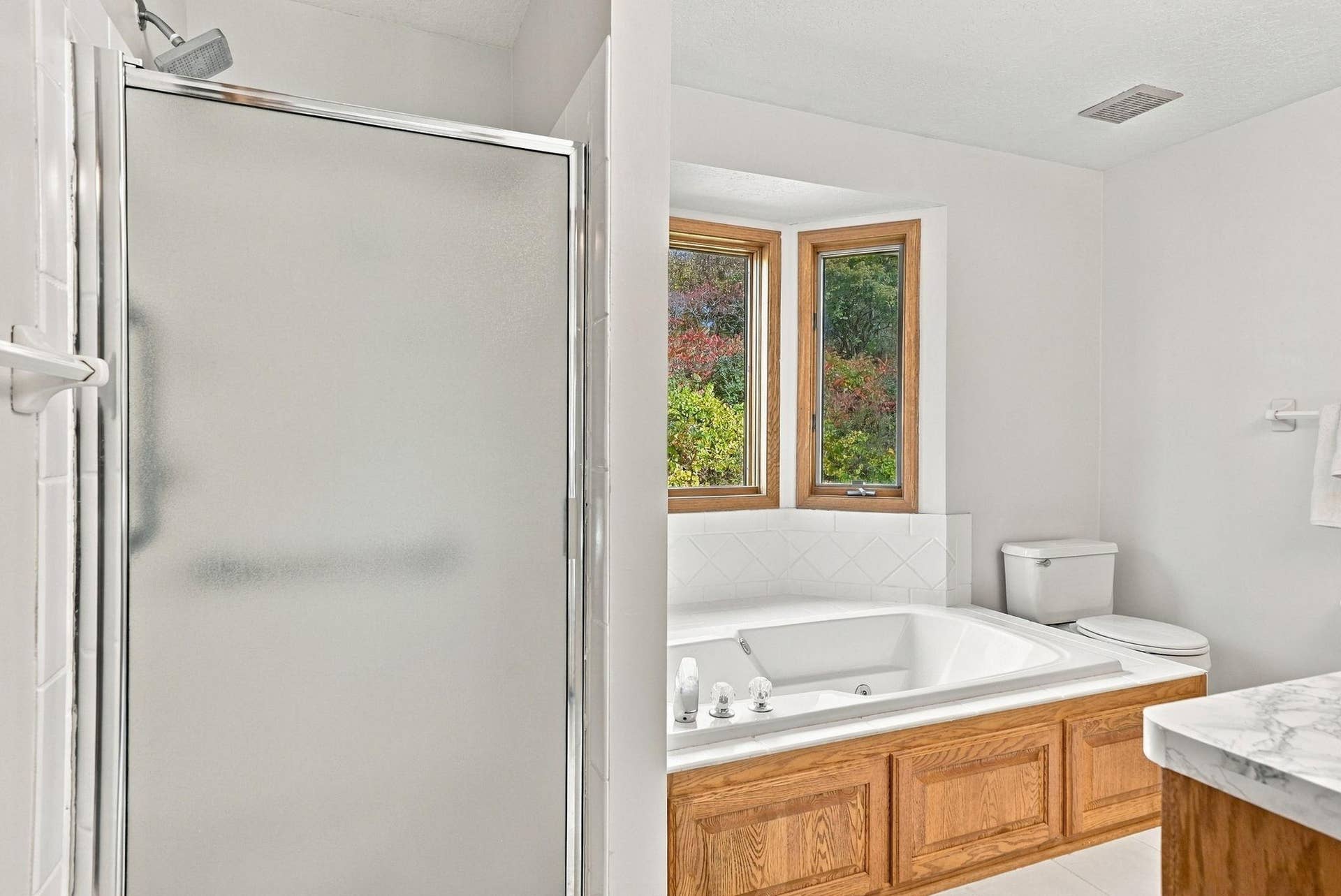 Separate shower and tub in primary bathroom