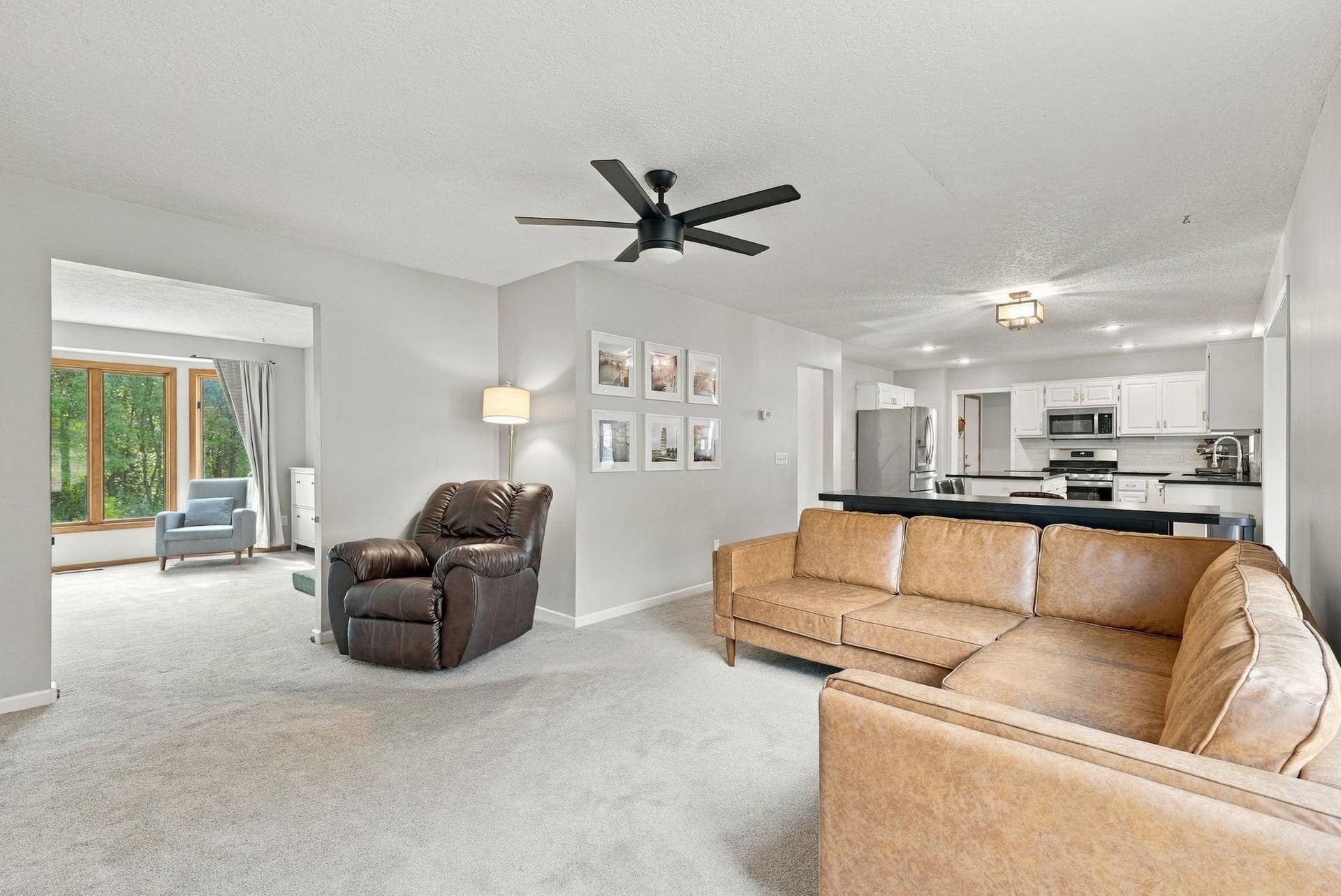 The home flows from room to room - that's the living room off the family room, with the kitchen in the background.